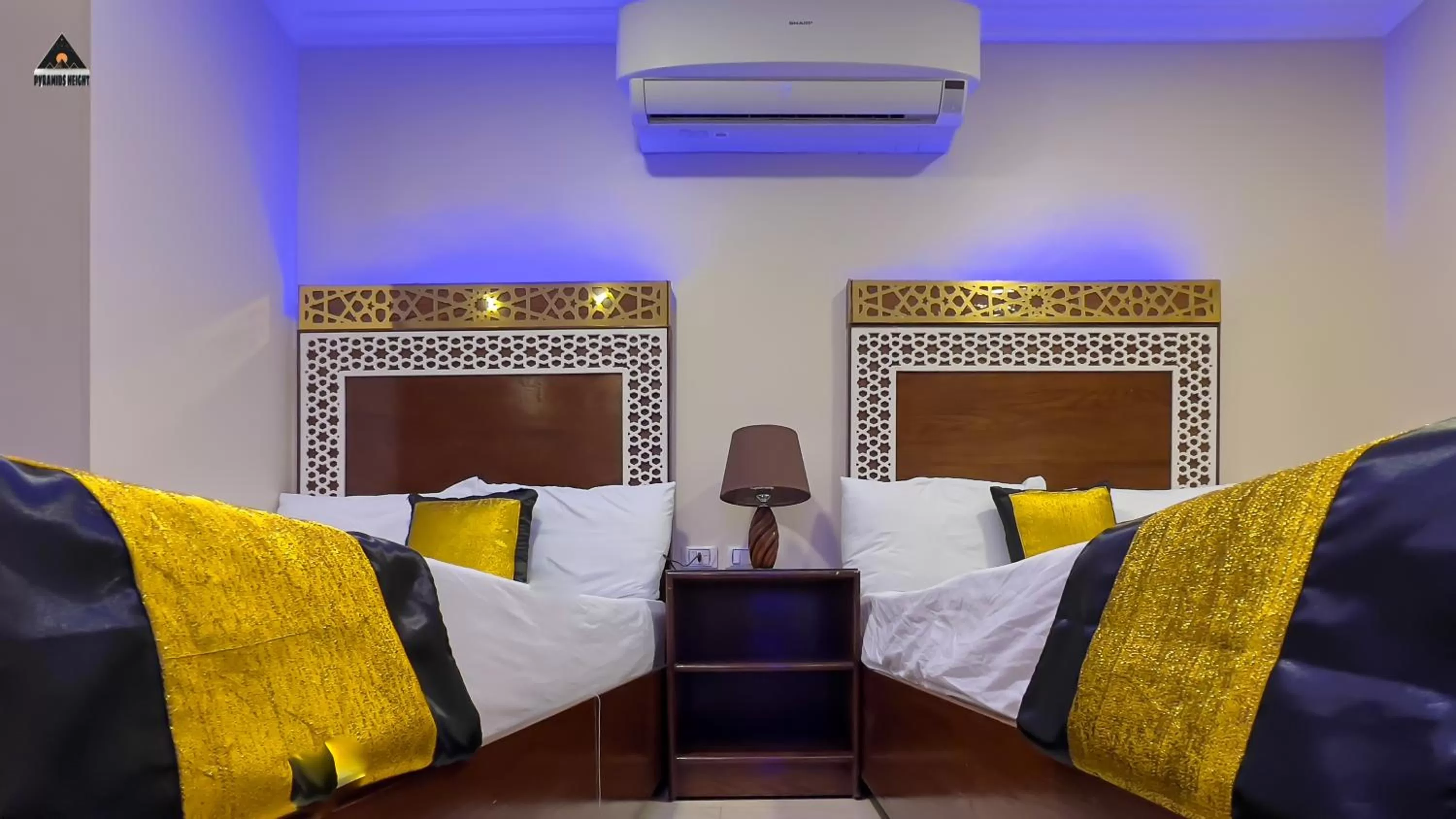 Bed in Pyramids Height Hotel & Pyramids Master Scene Rooftop