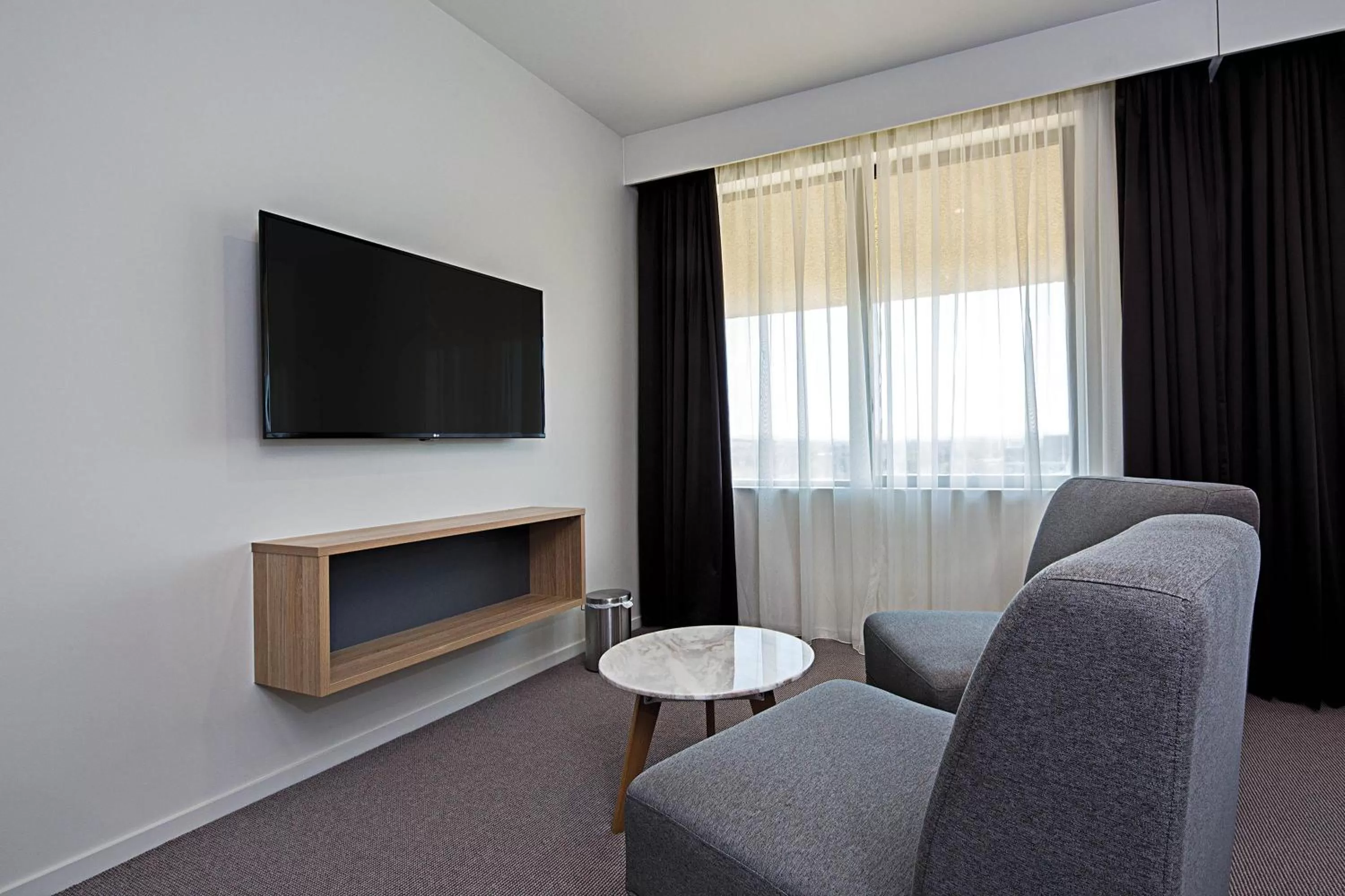 Living room in Mantra MacArthur Hotel