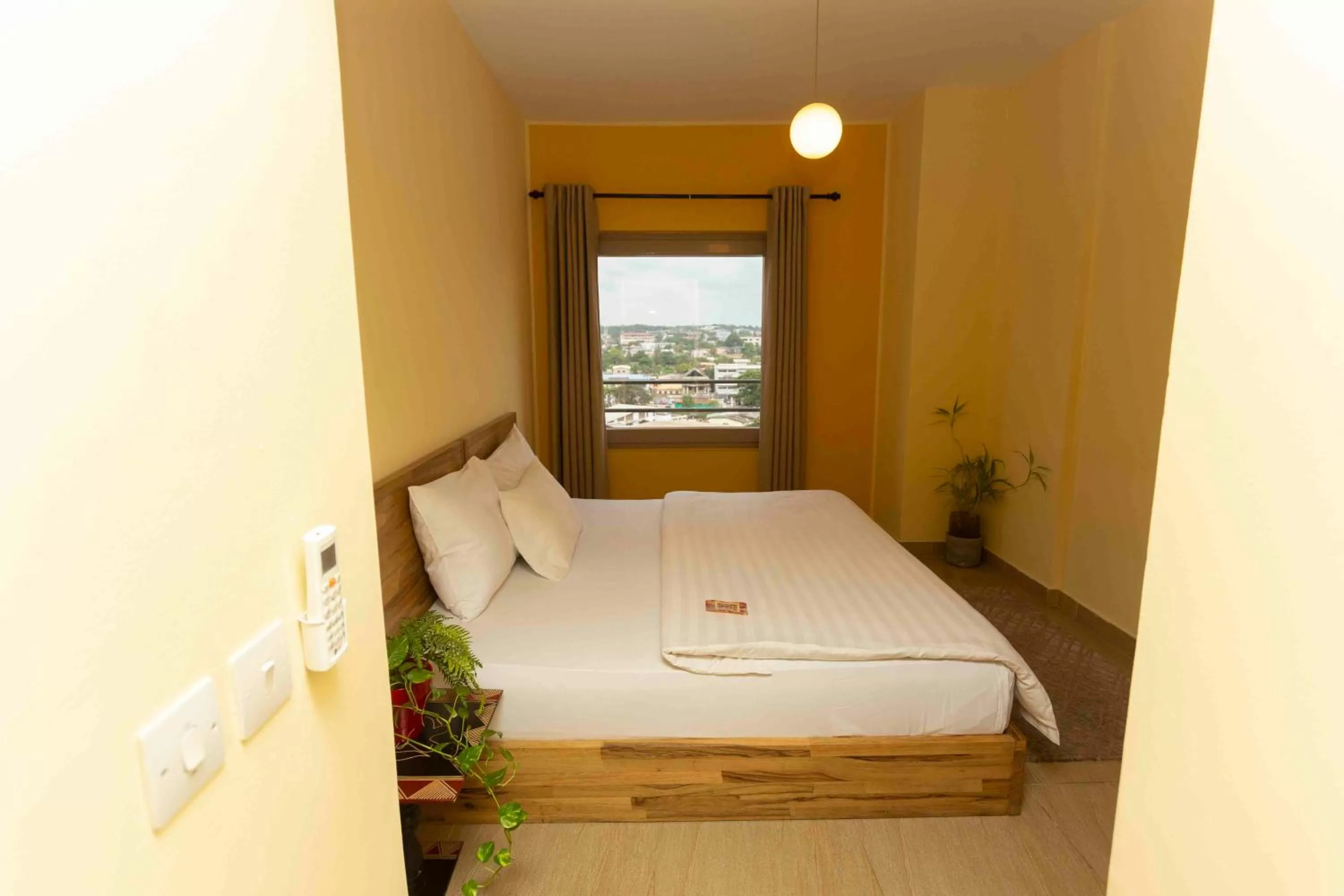 Bed in Roots Hotel Apartment