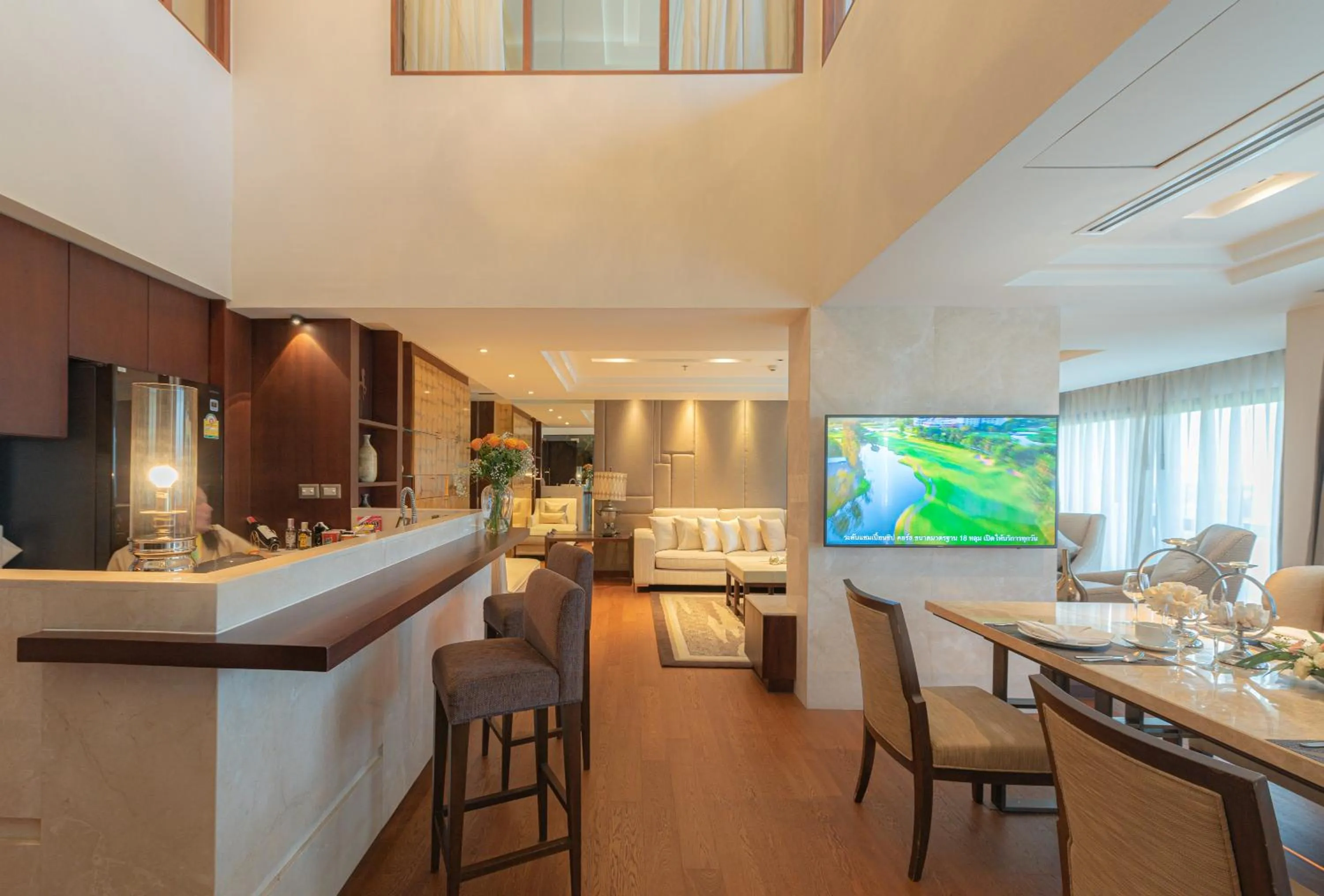 Living room in Summit Windmill Golf Suite Hotel at Suvarnabhumi