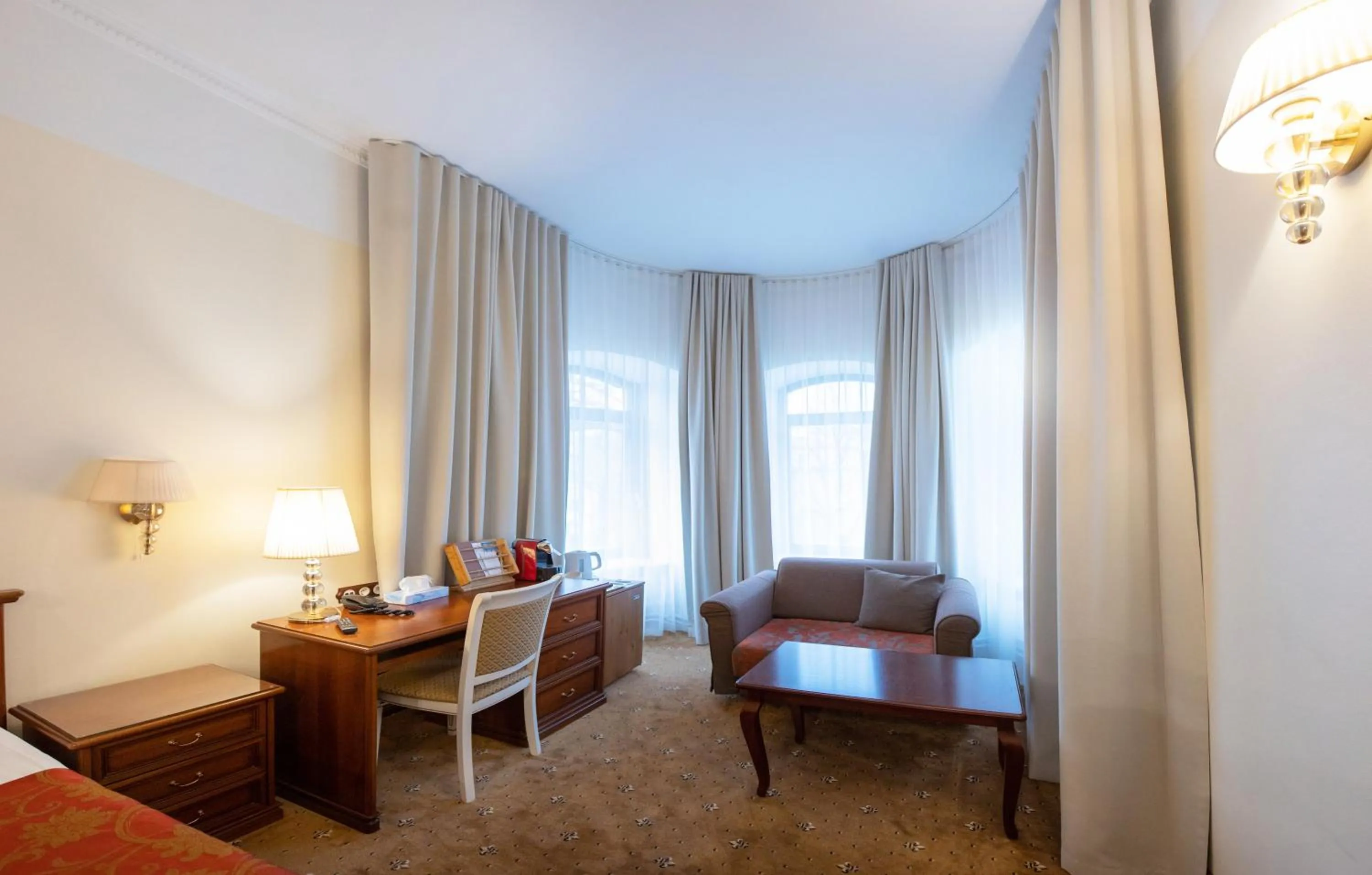 Seating area, Bed in Hotel St. Barbara