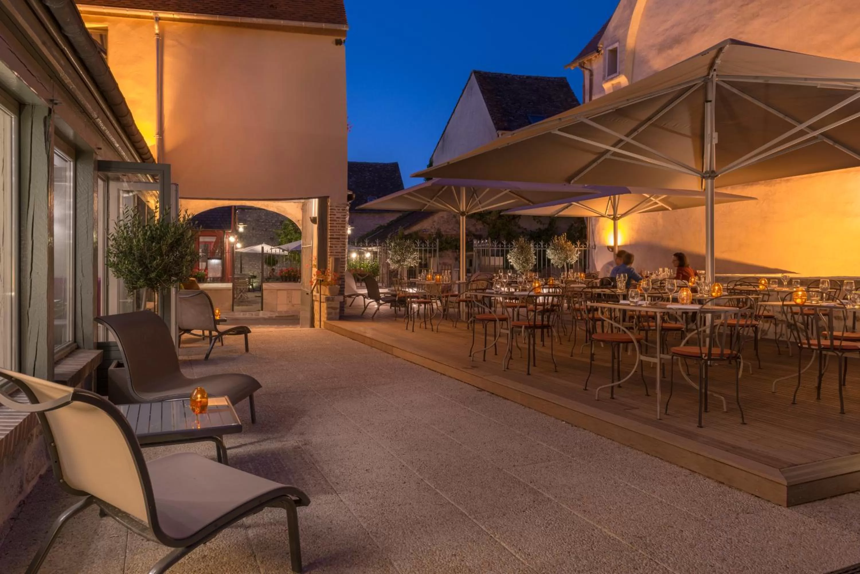 Patio in Hôtel Aux Vieux Remparts, The Originals Relais