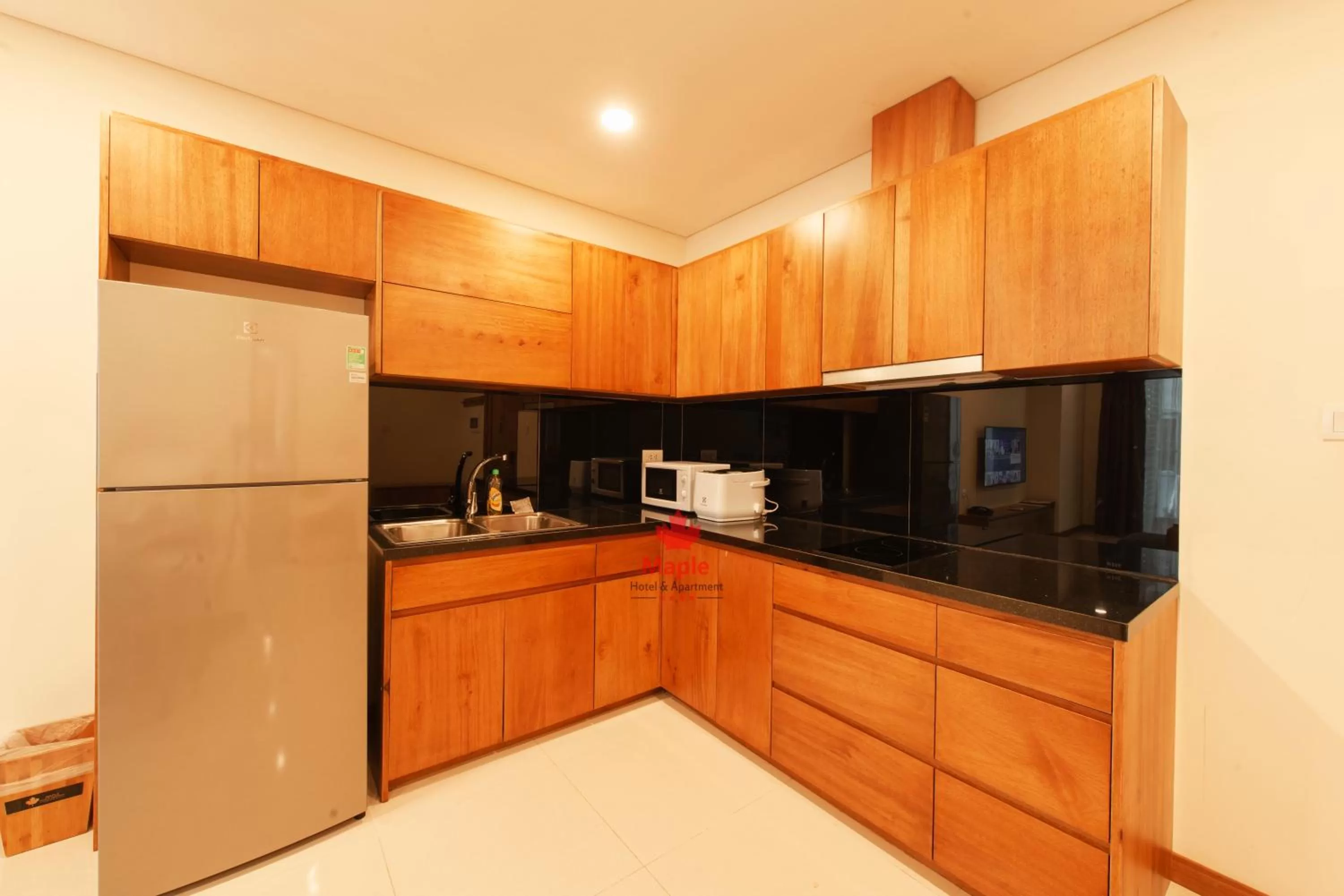 Kitchen or kitchenette in Maple Hotel & Apartment