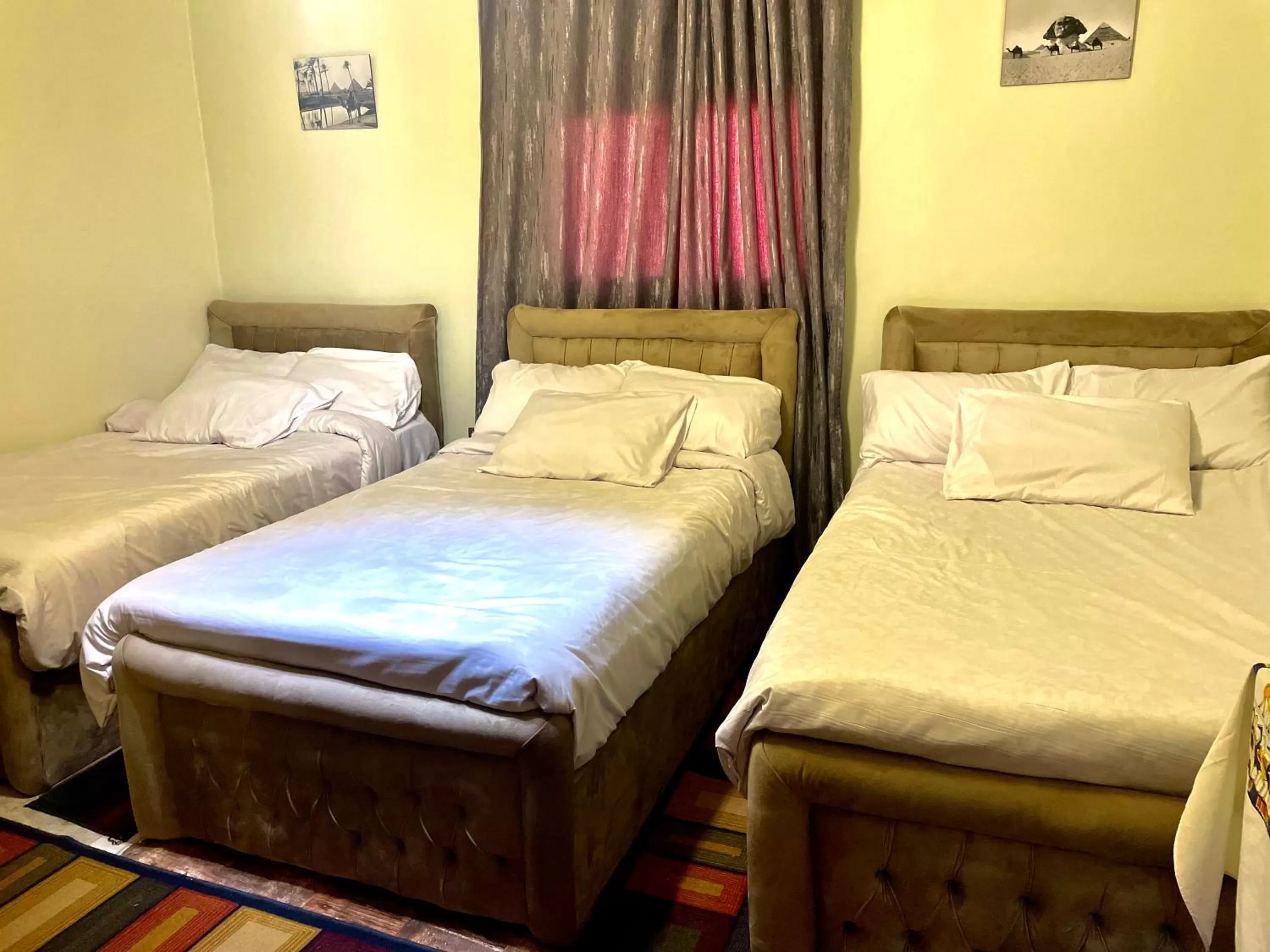 Bed in Sphinx palace pyramids view