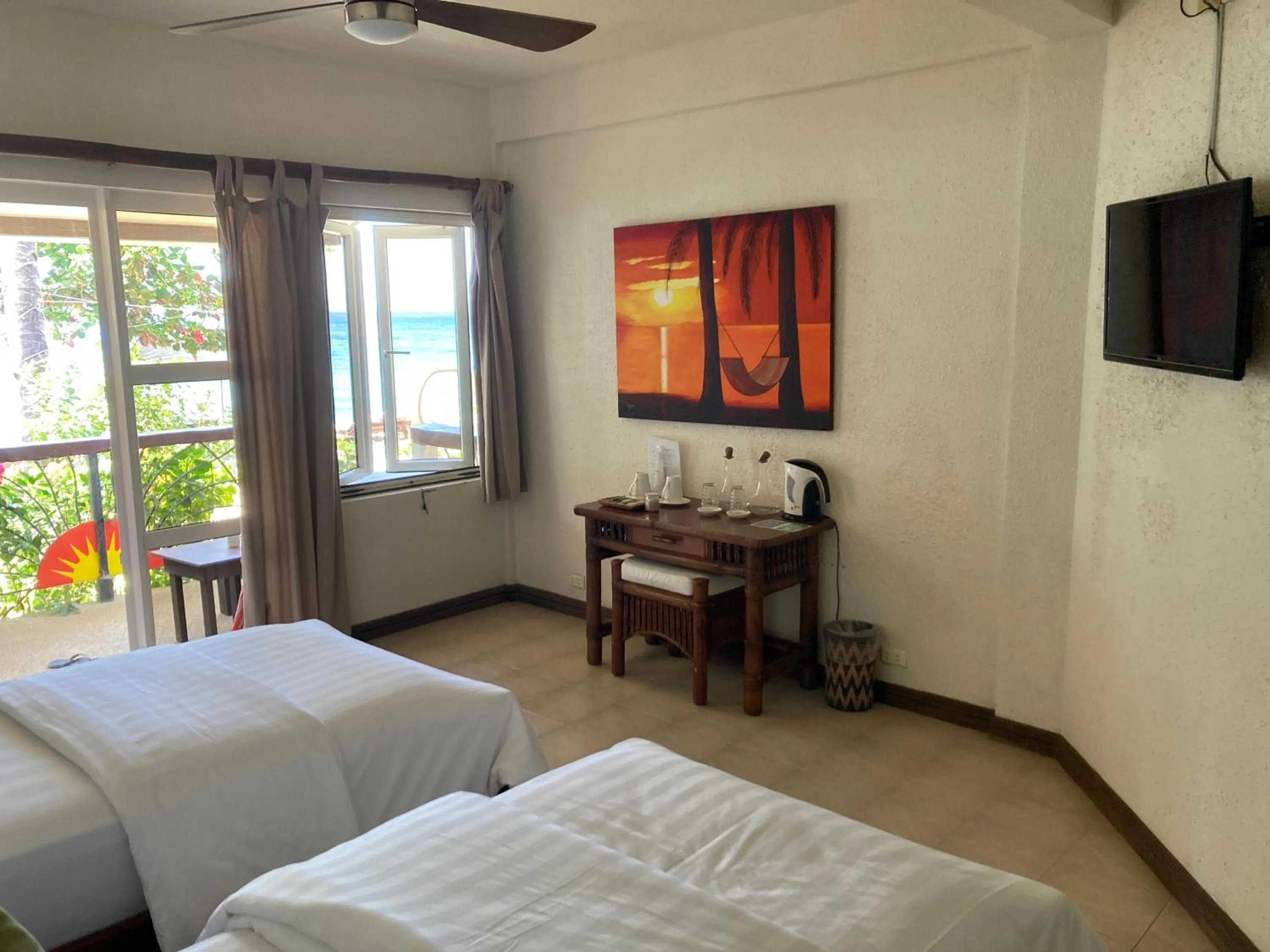 Bed in Sunset At Aninuan Beach Resort