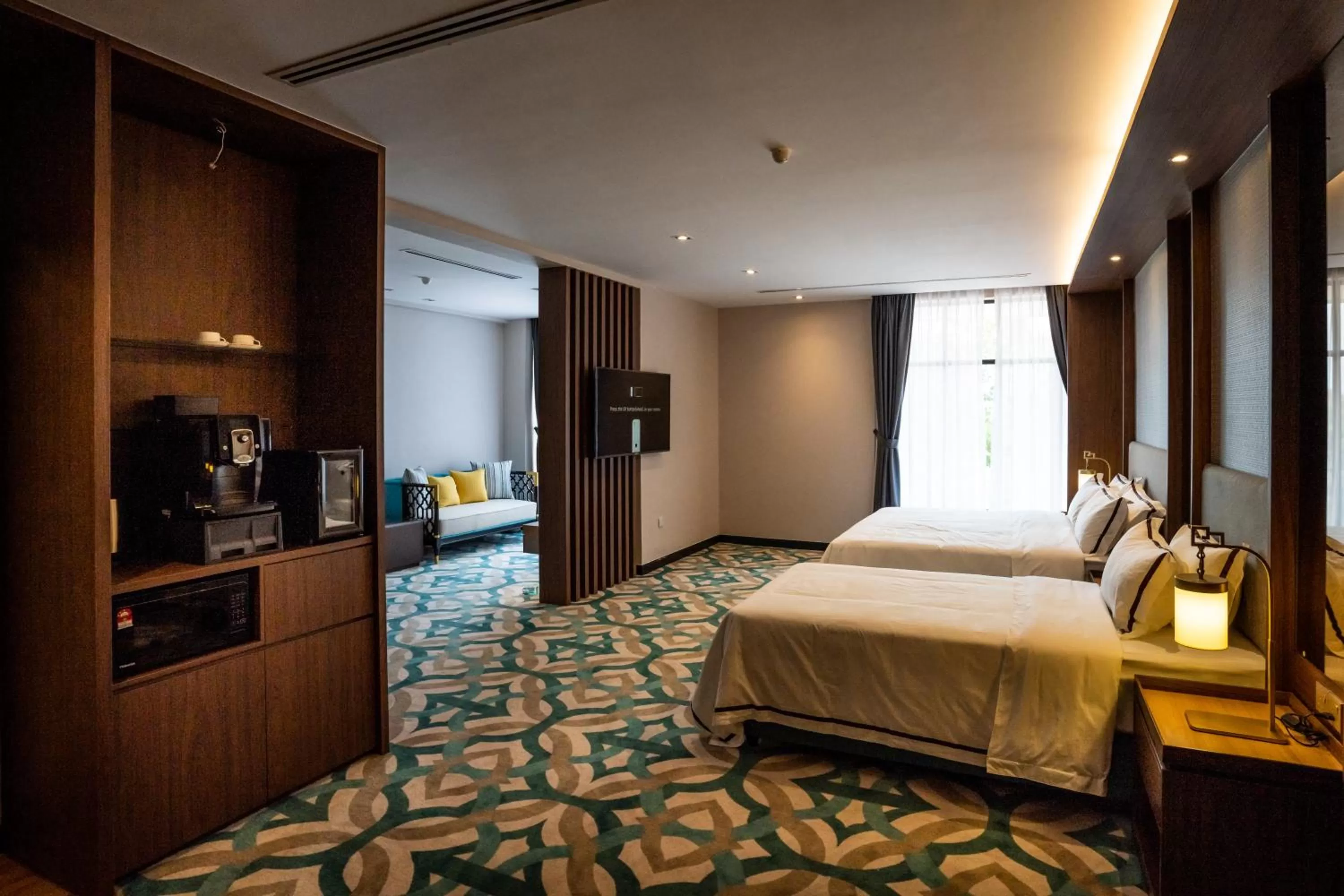 Bed in CHRISTEE SUITES HOTEL