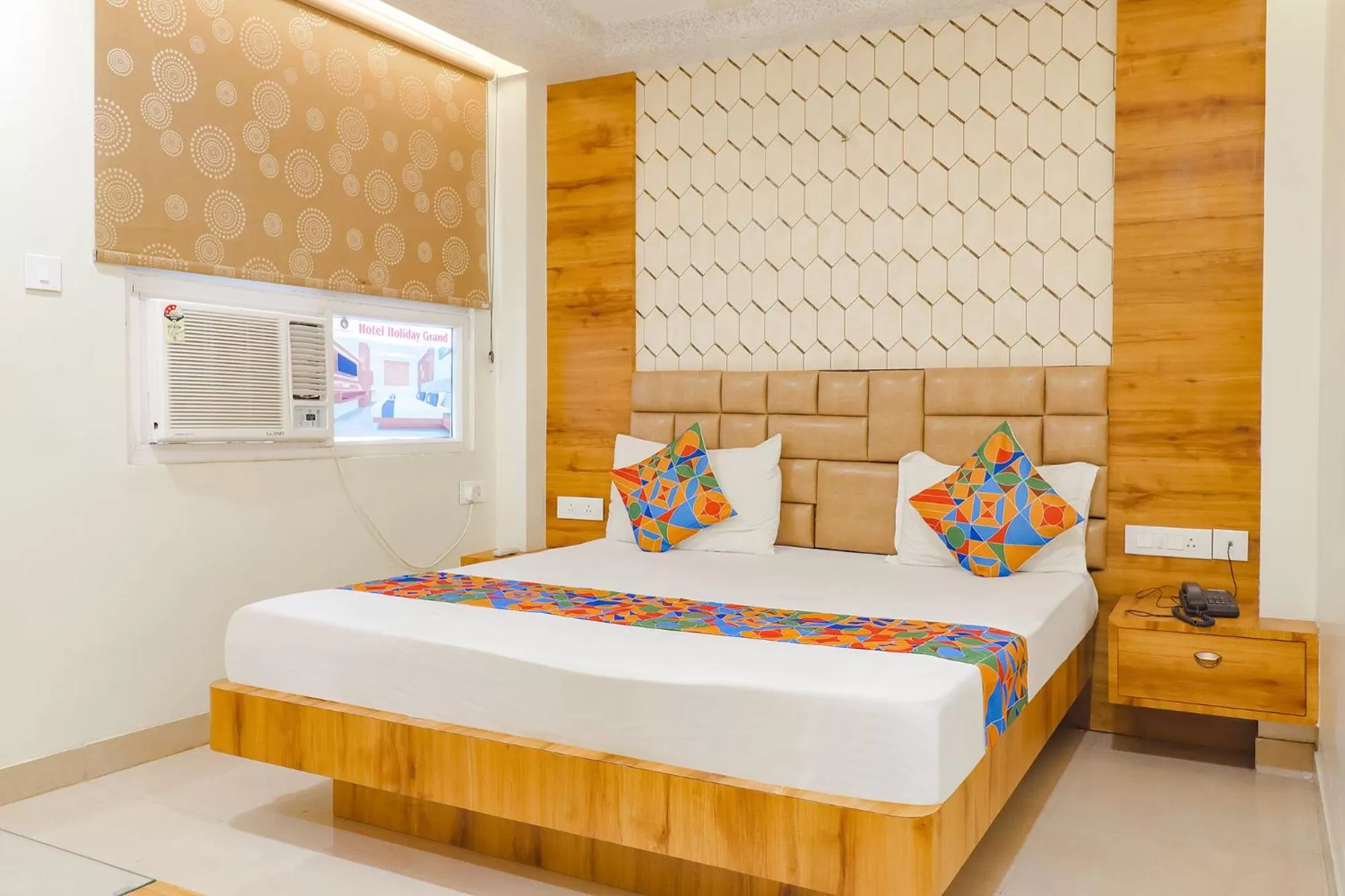 Bed in FabHotel Holiday Grand