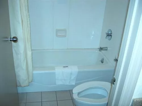 Bathroom in Travelers Inn & Suites