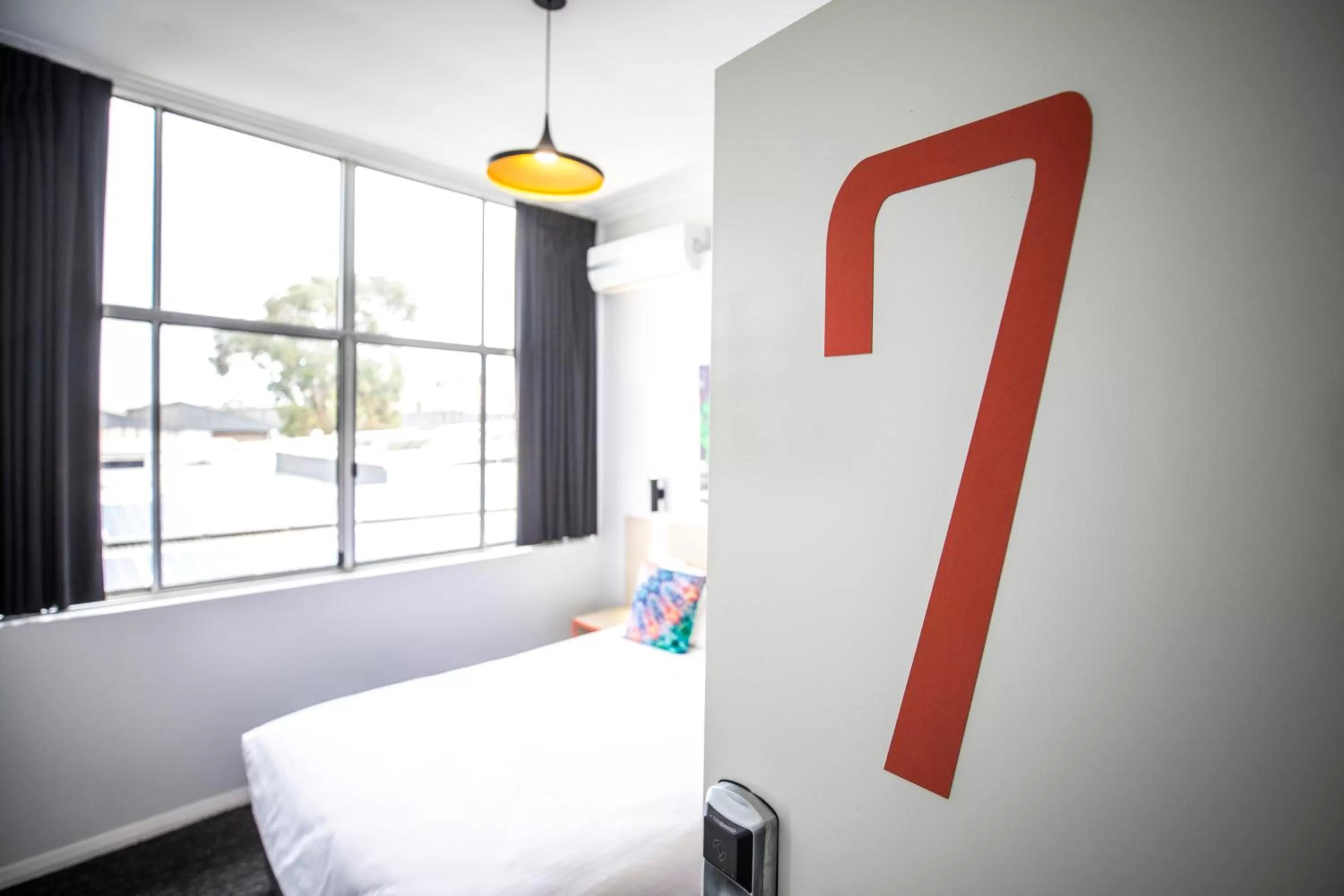 Bedroom, Bed in Nightcap at Ashley Hotel