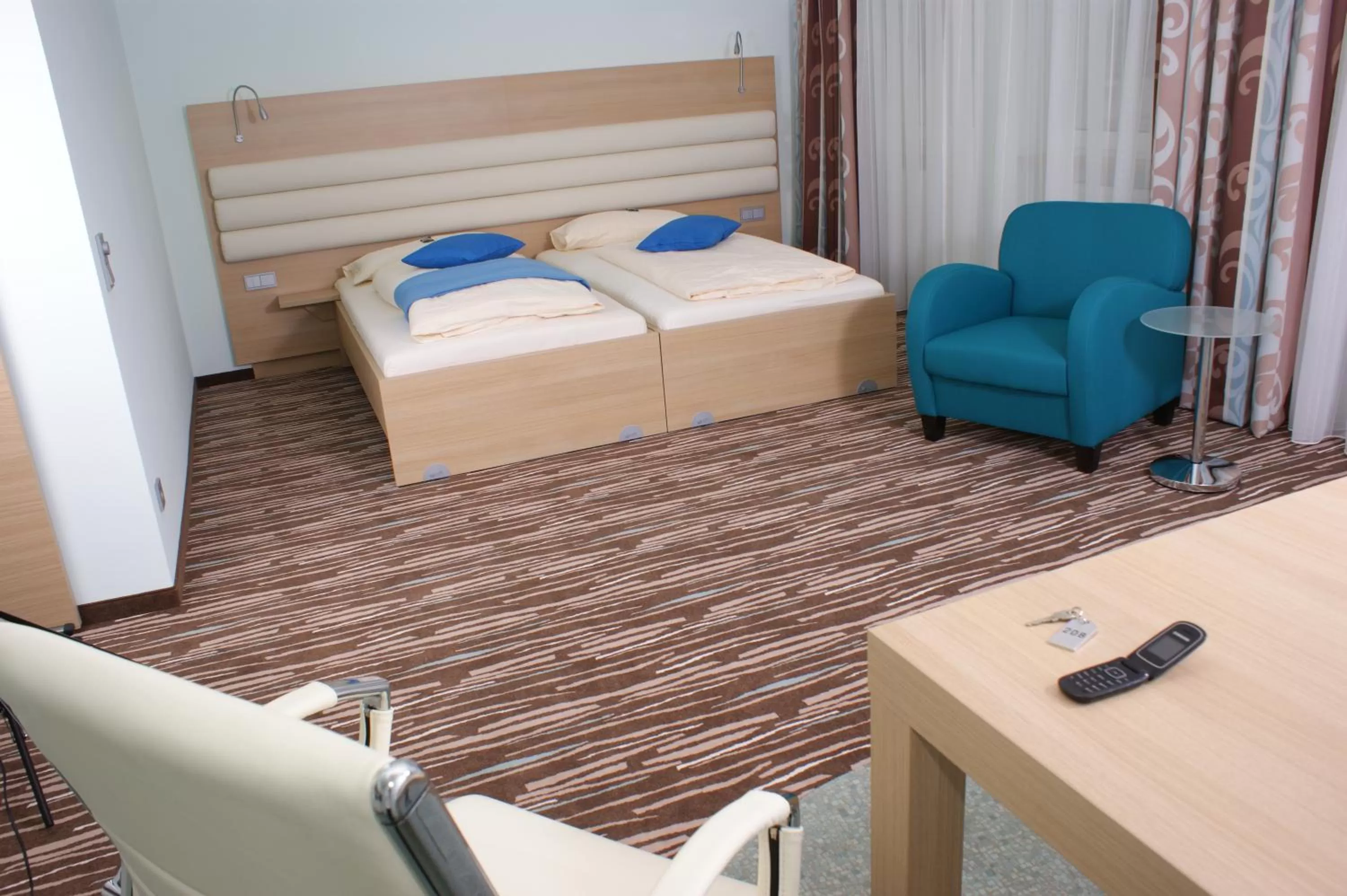 Photo of the whole room, Bed in Hotel Peterhof - urban lifestyle Kempten