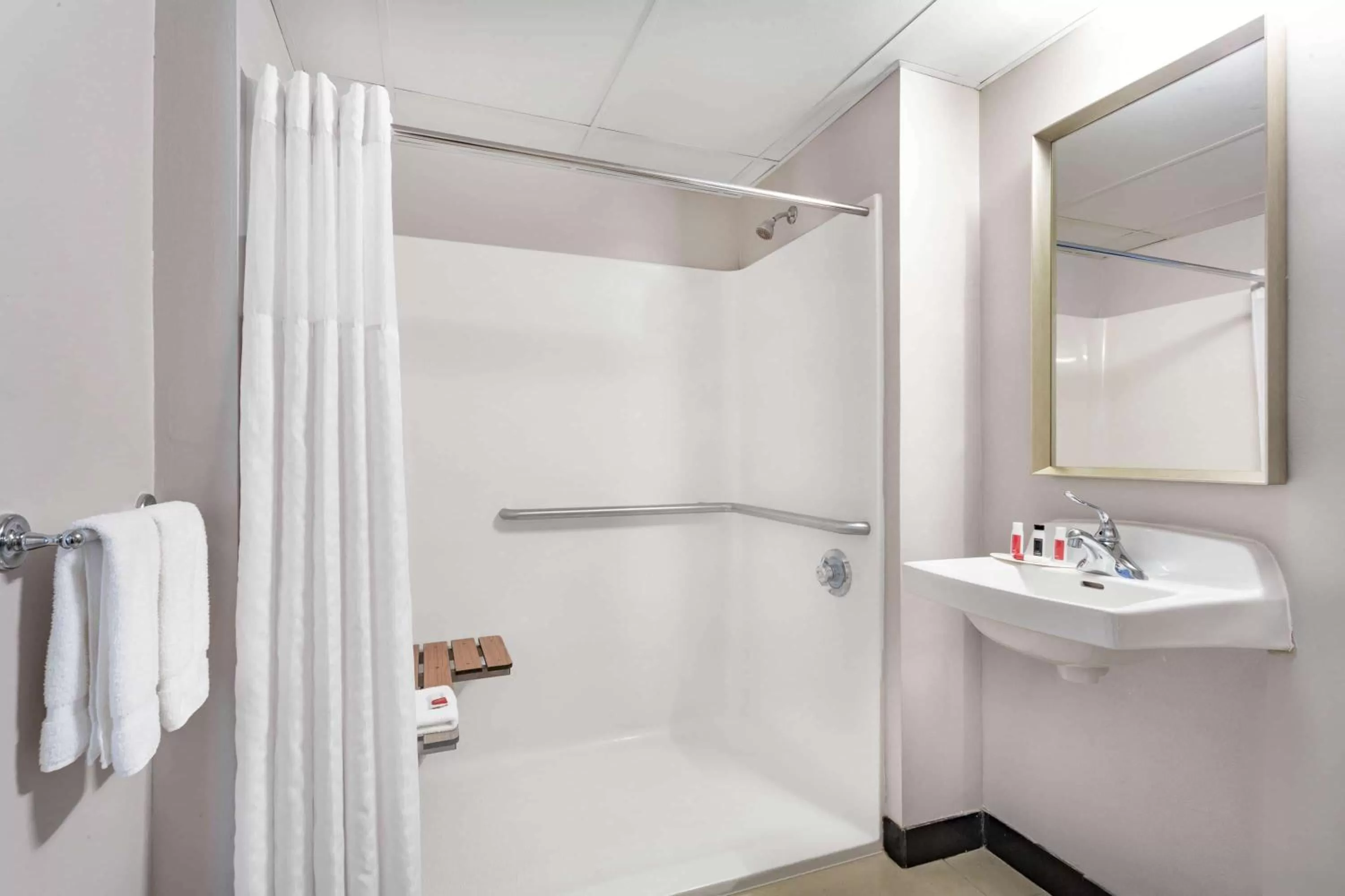 Bathroom in Ramada by Wyndham Hartford North - Bradley Airport