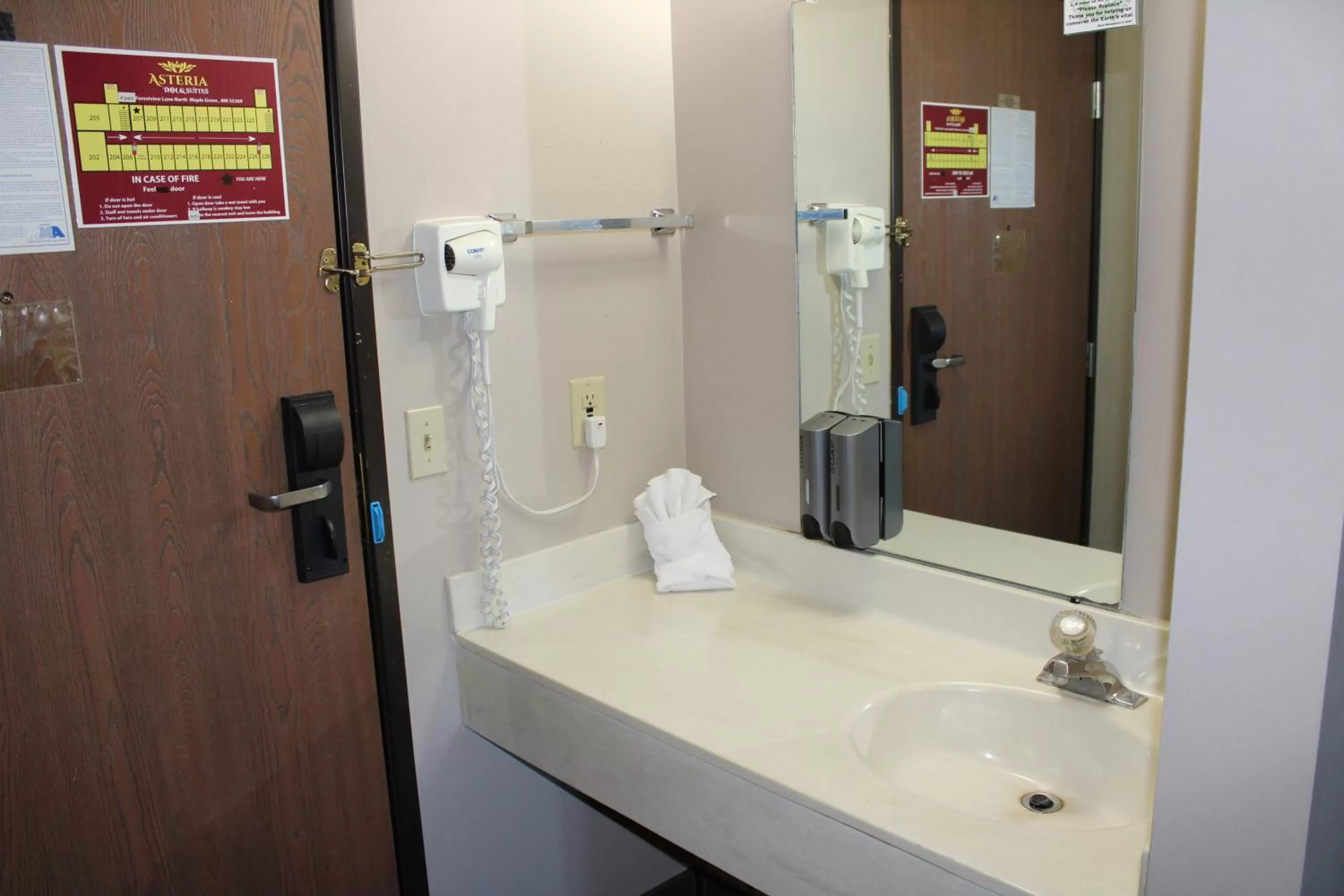 Bathroom in Coratel Inn and Suites Maple Grove