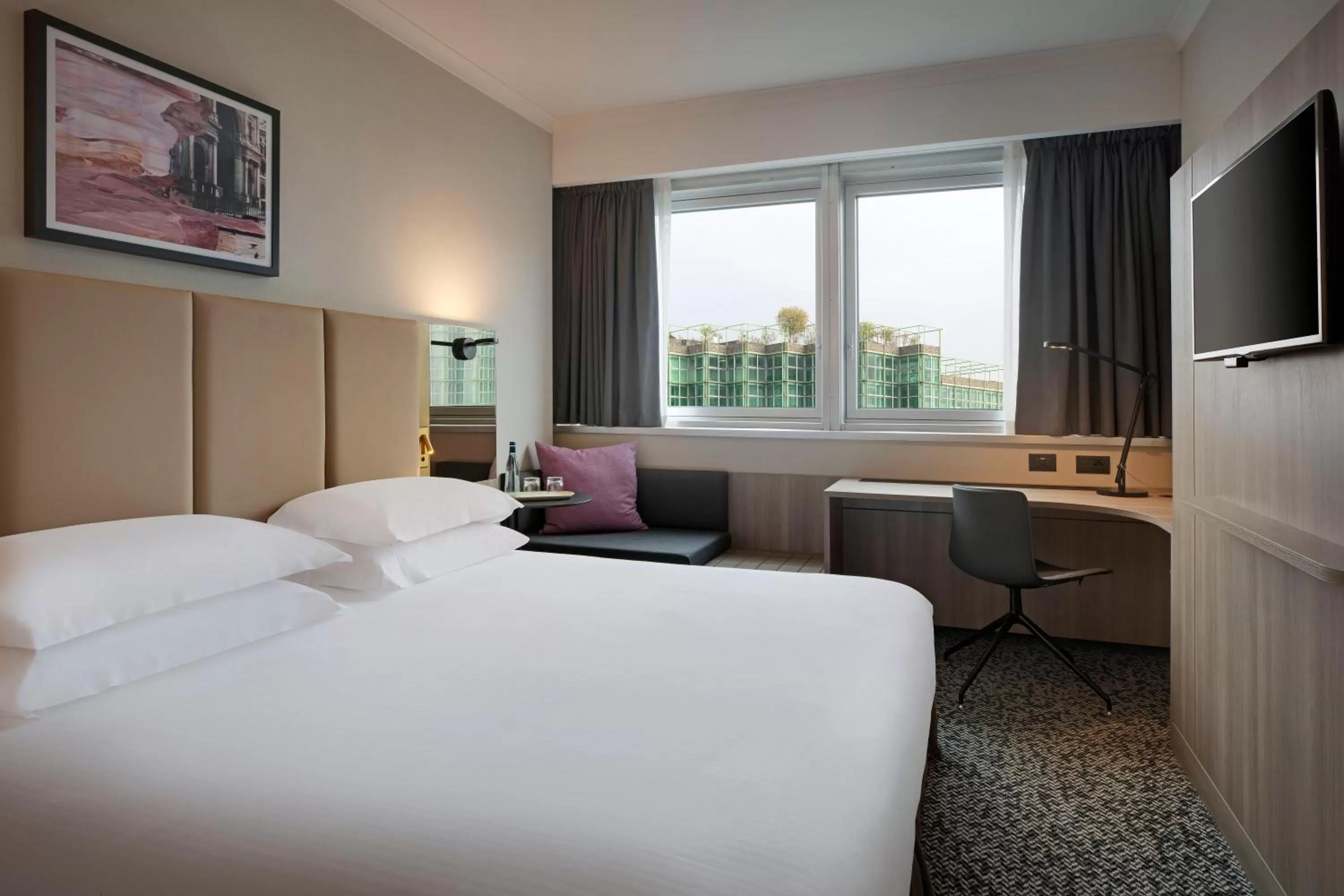 Photo of the whole room, Bed in Crowne Plaza Milan Linate by IHG