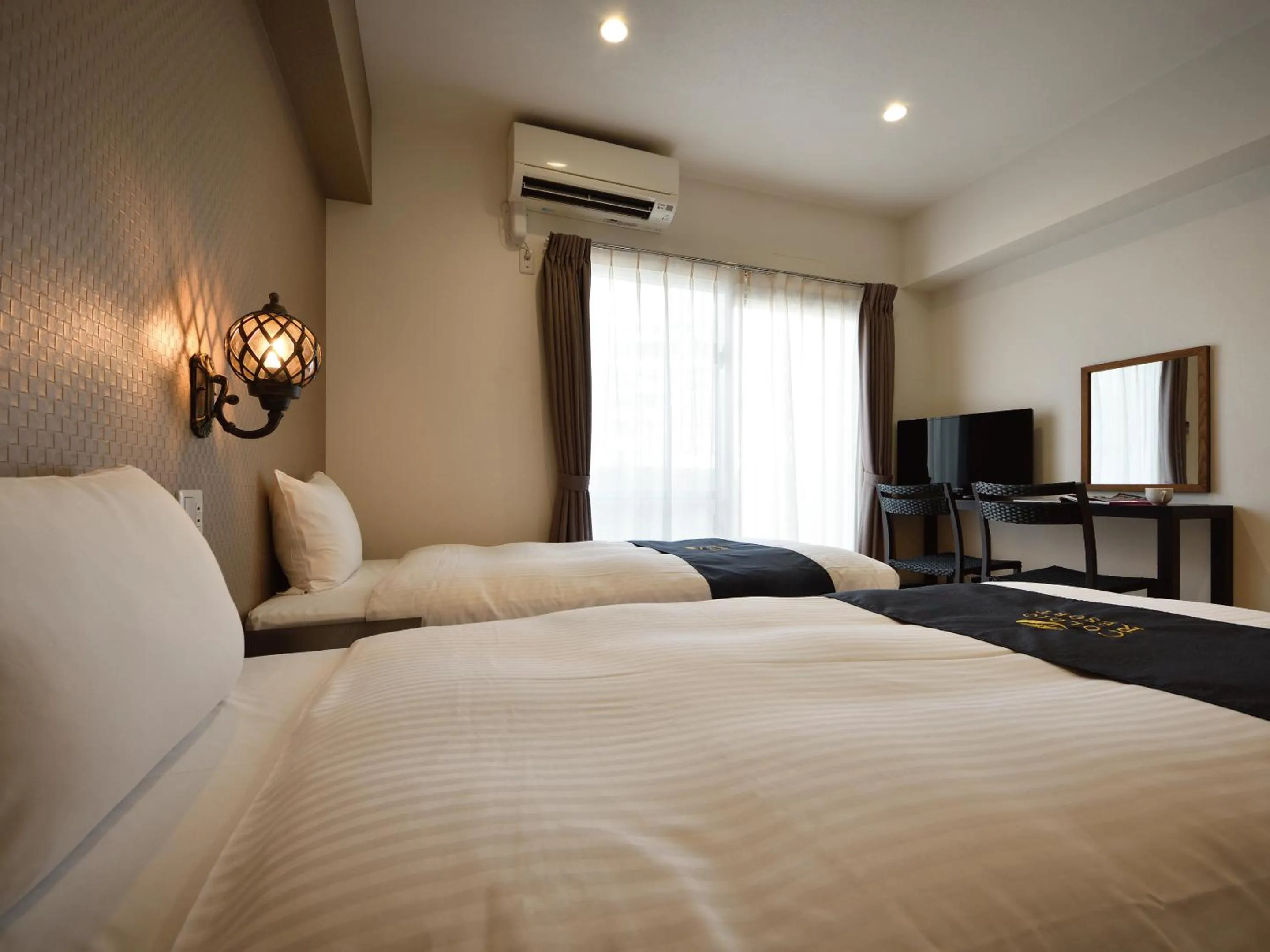 Bed in Condominium L's INN