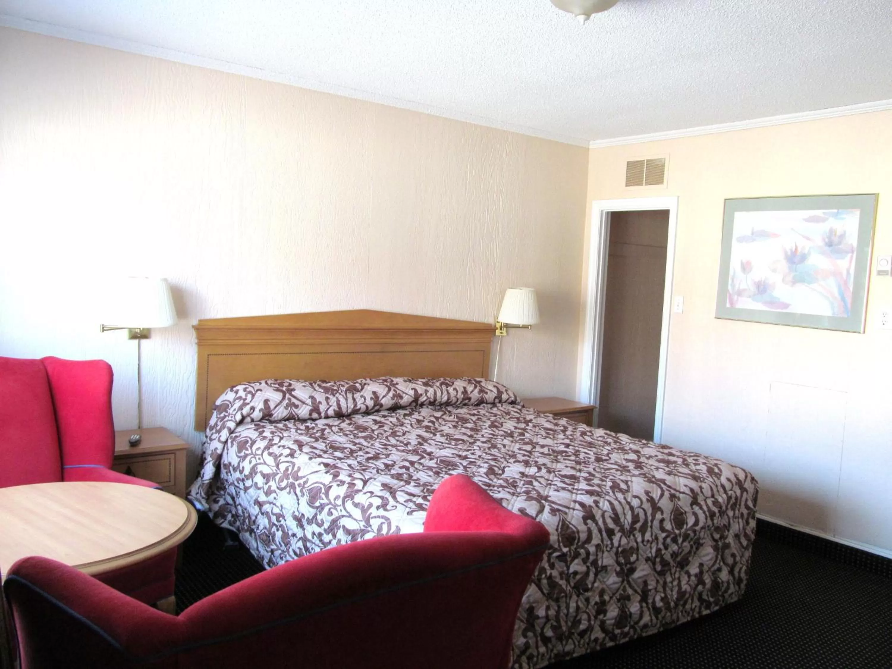 Bed in Knights Inn London Ontario