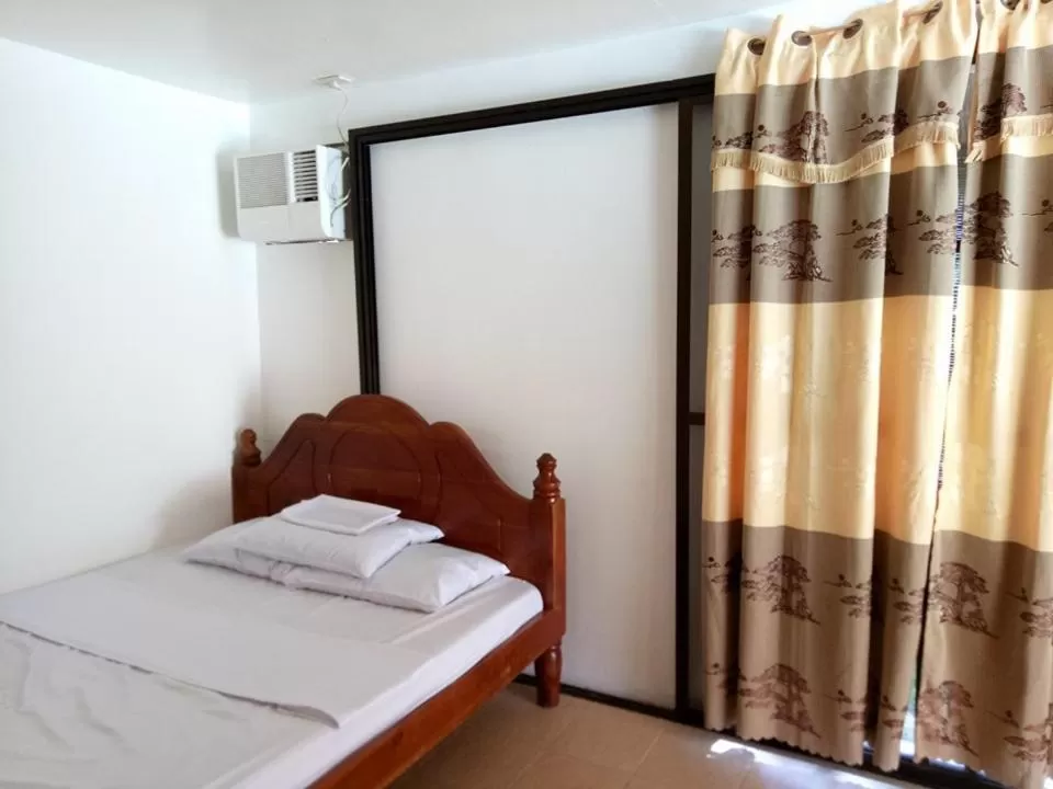 Bed in Camaya-an Paradise Beach Resort