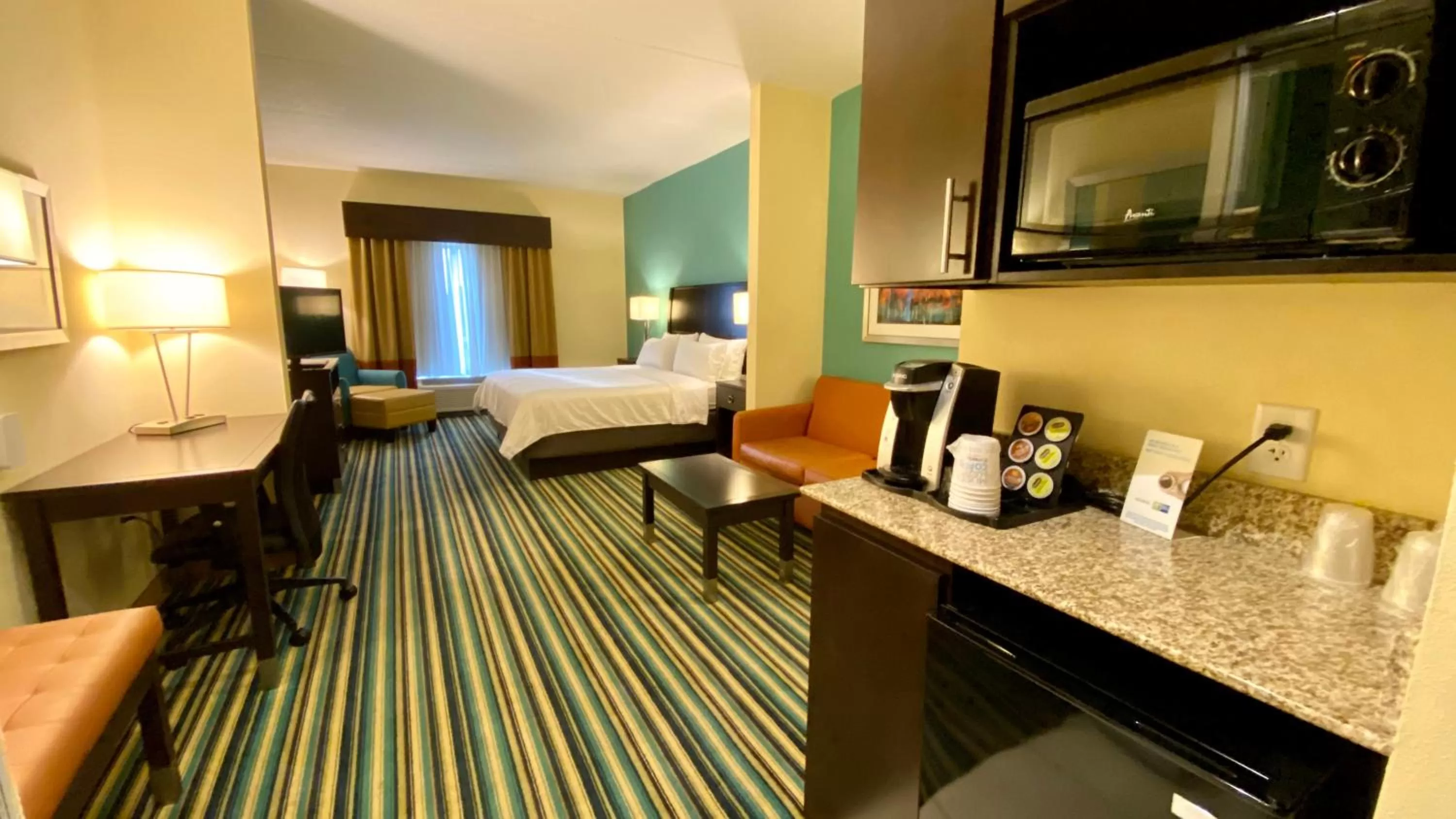 Photo of the whole room, Bed in Holiday Inn Express Hotel & Suites Orlando East-UCF Area by IHG
