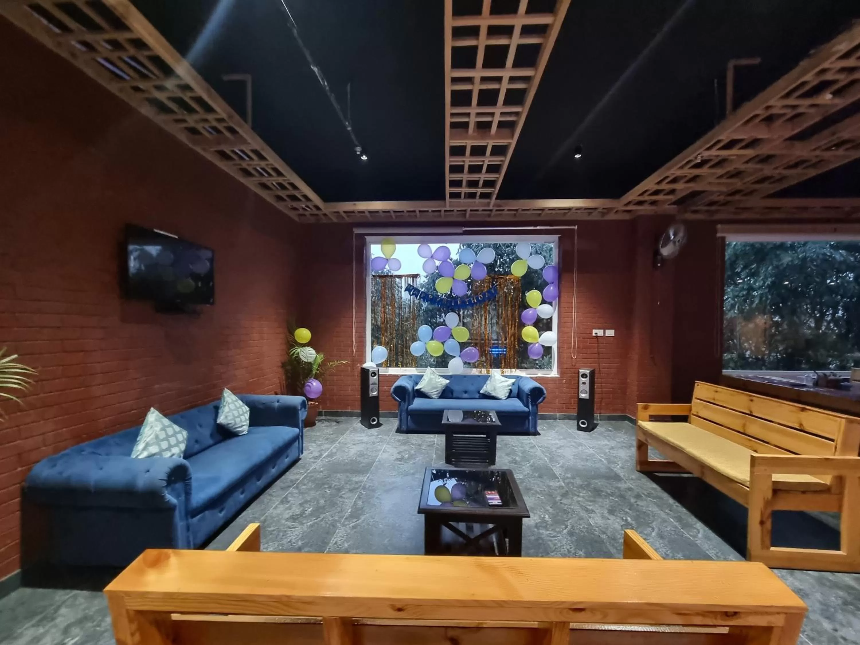 Communal lounge/ TV room in Moon Glade By Stylia Hotels