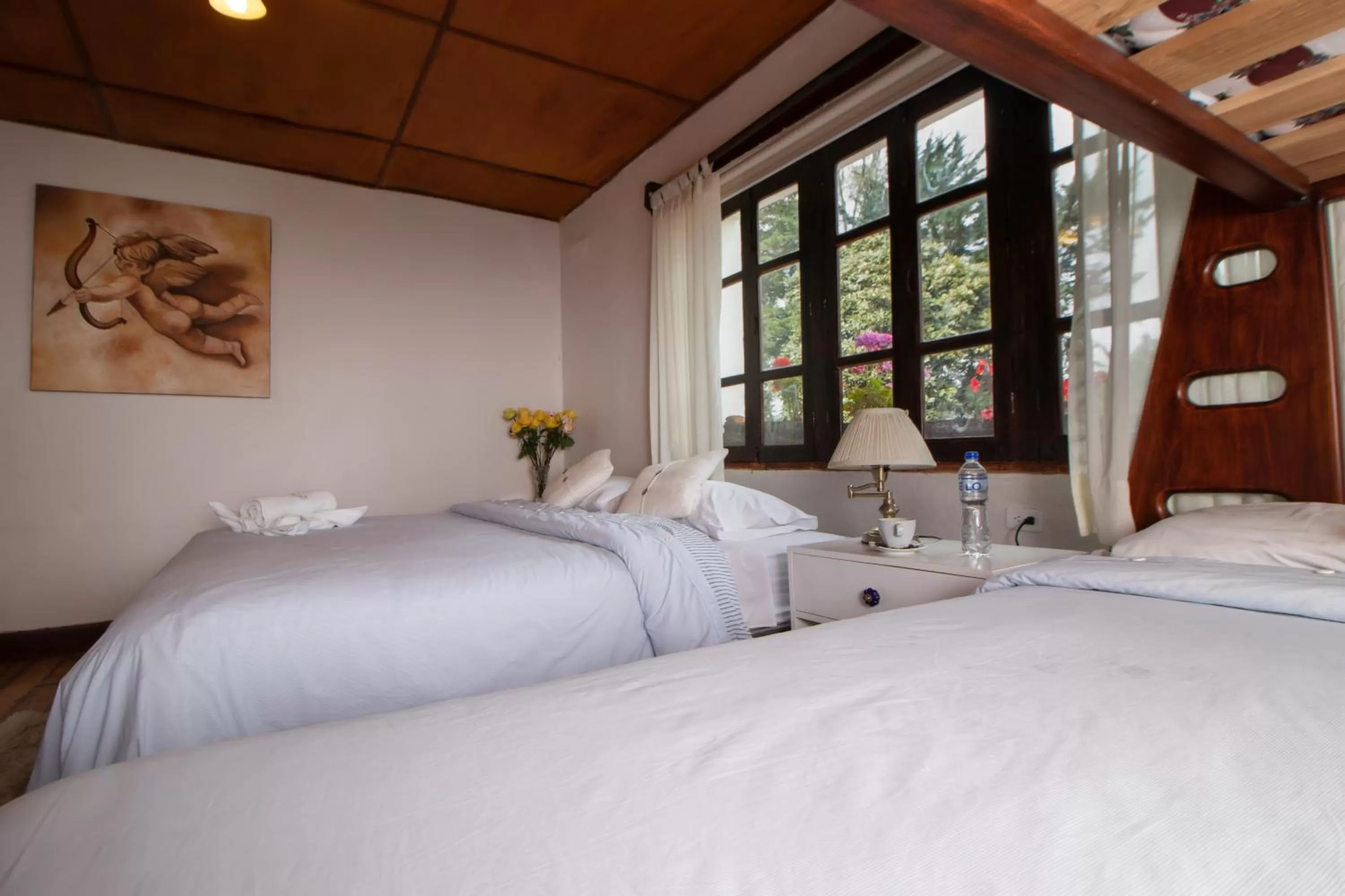 Bed in Hosteria Papagayo Cotopaxi