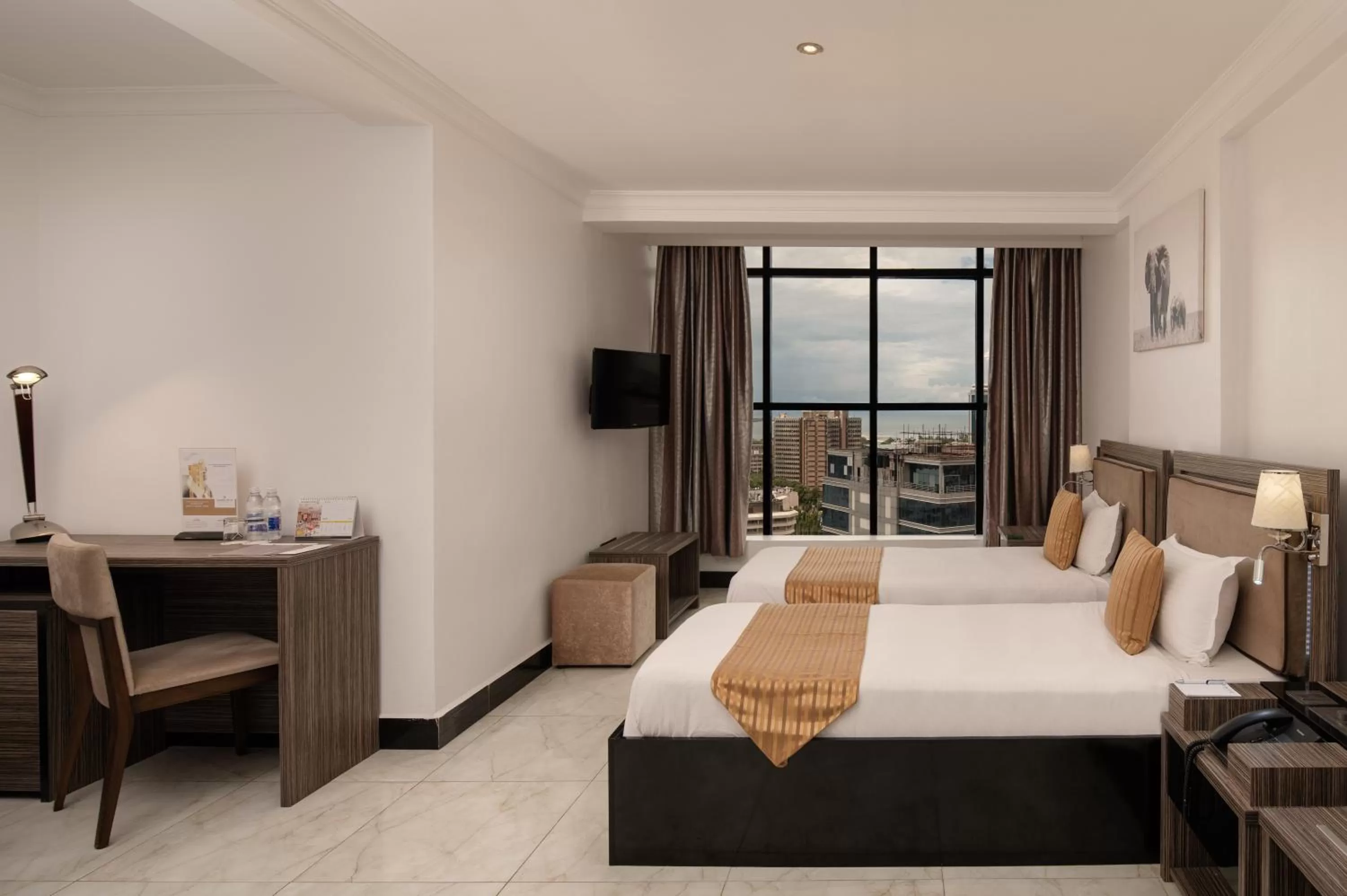Photo of the whole room, Bed in Golden Tulip Dar Es Salaam City Center Hotel