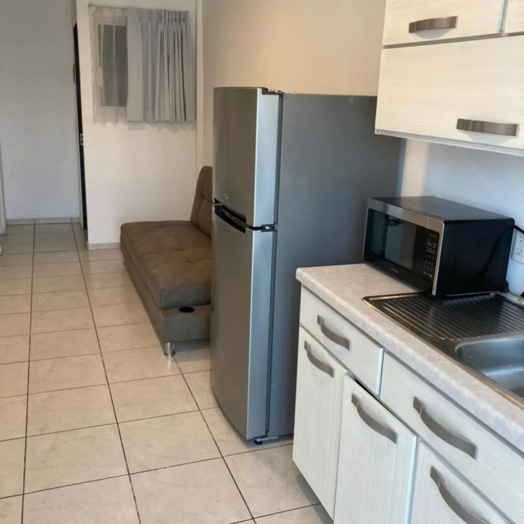 Kitchen or kitchenette in Container Inn Hotel Aeropuerto