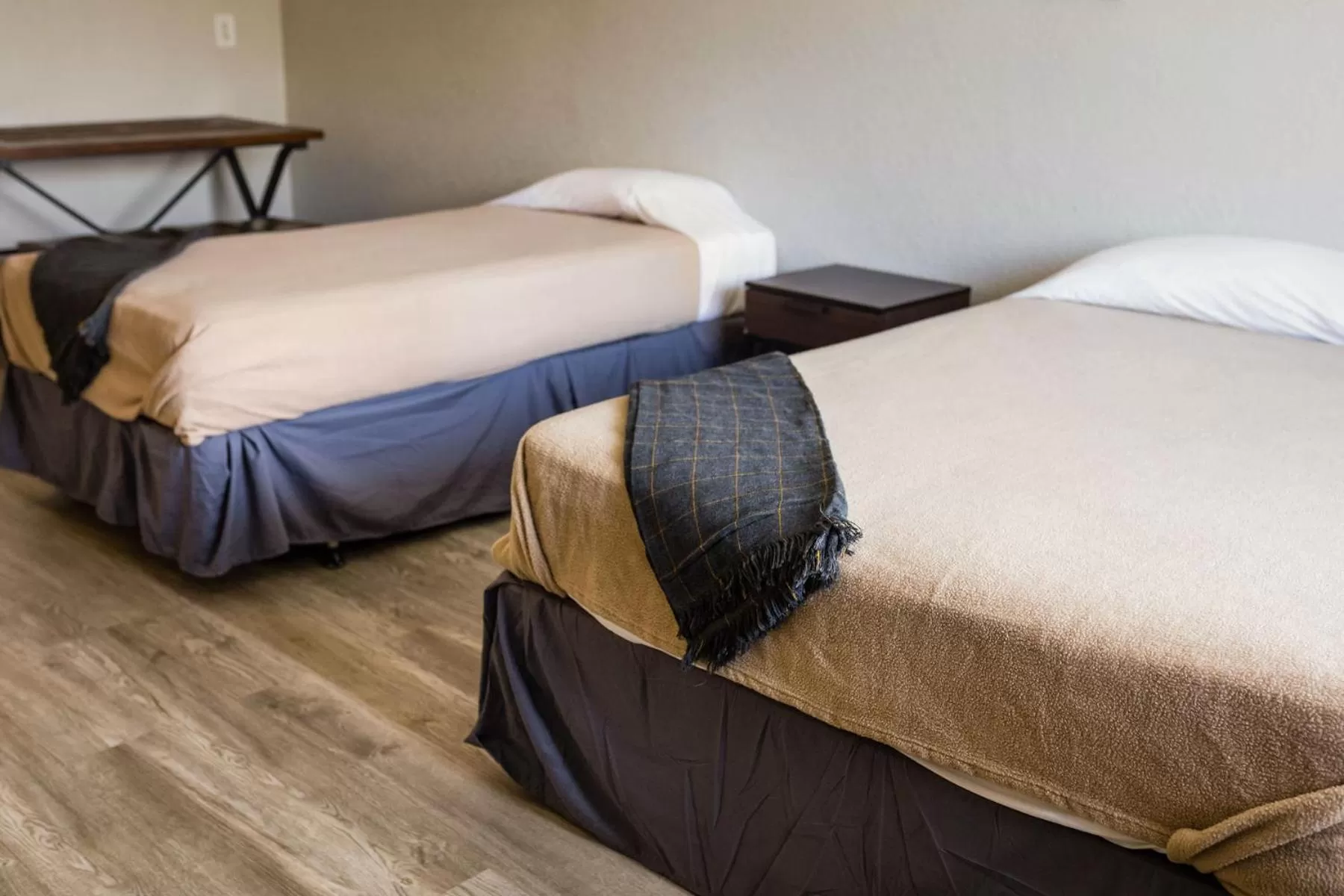 Bed in Merit Inn and Suites