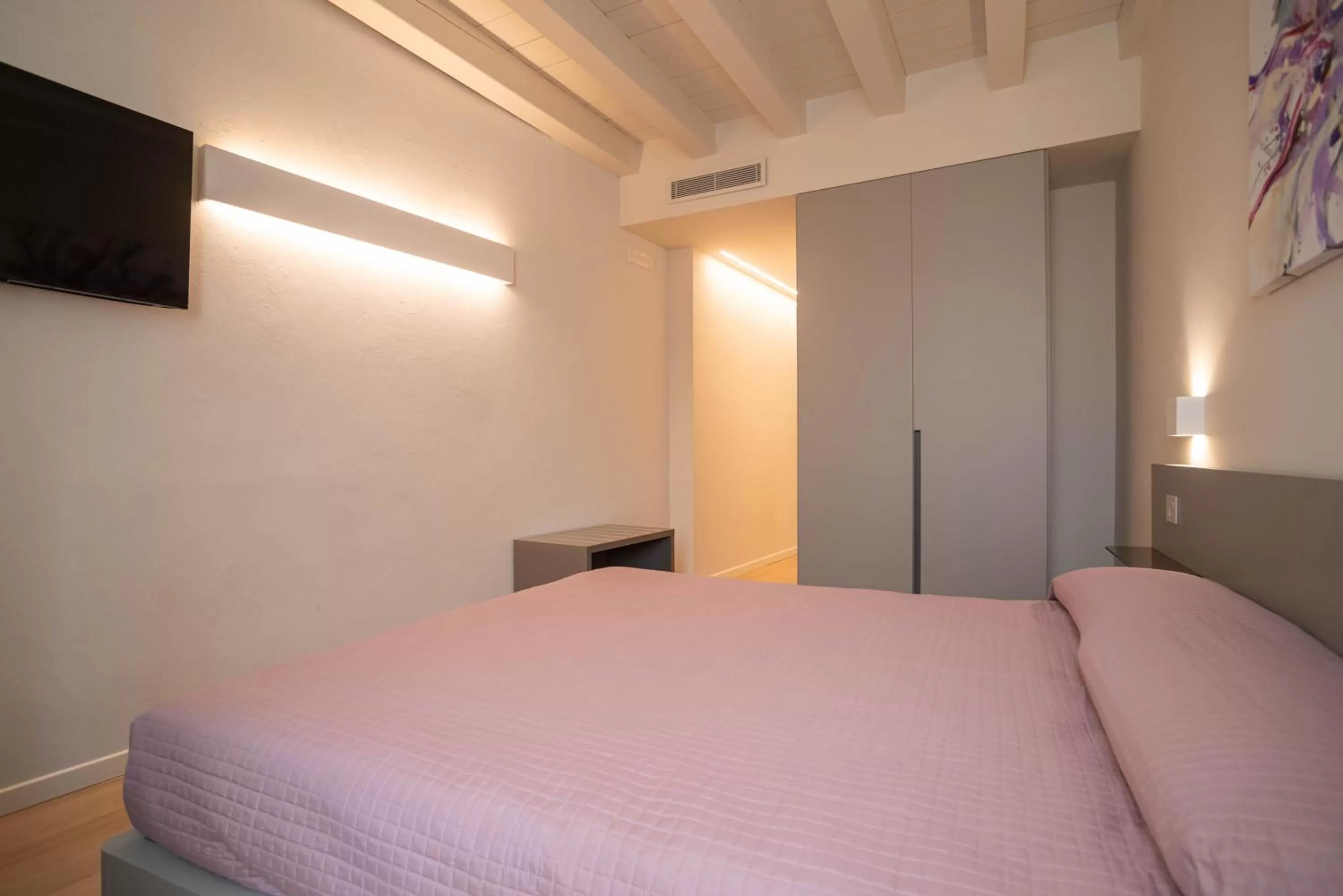 Bed in Maison Calcirelli rooms