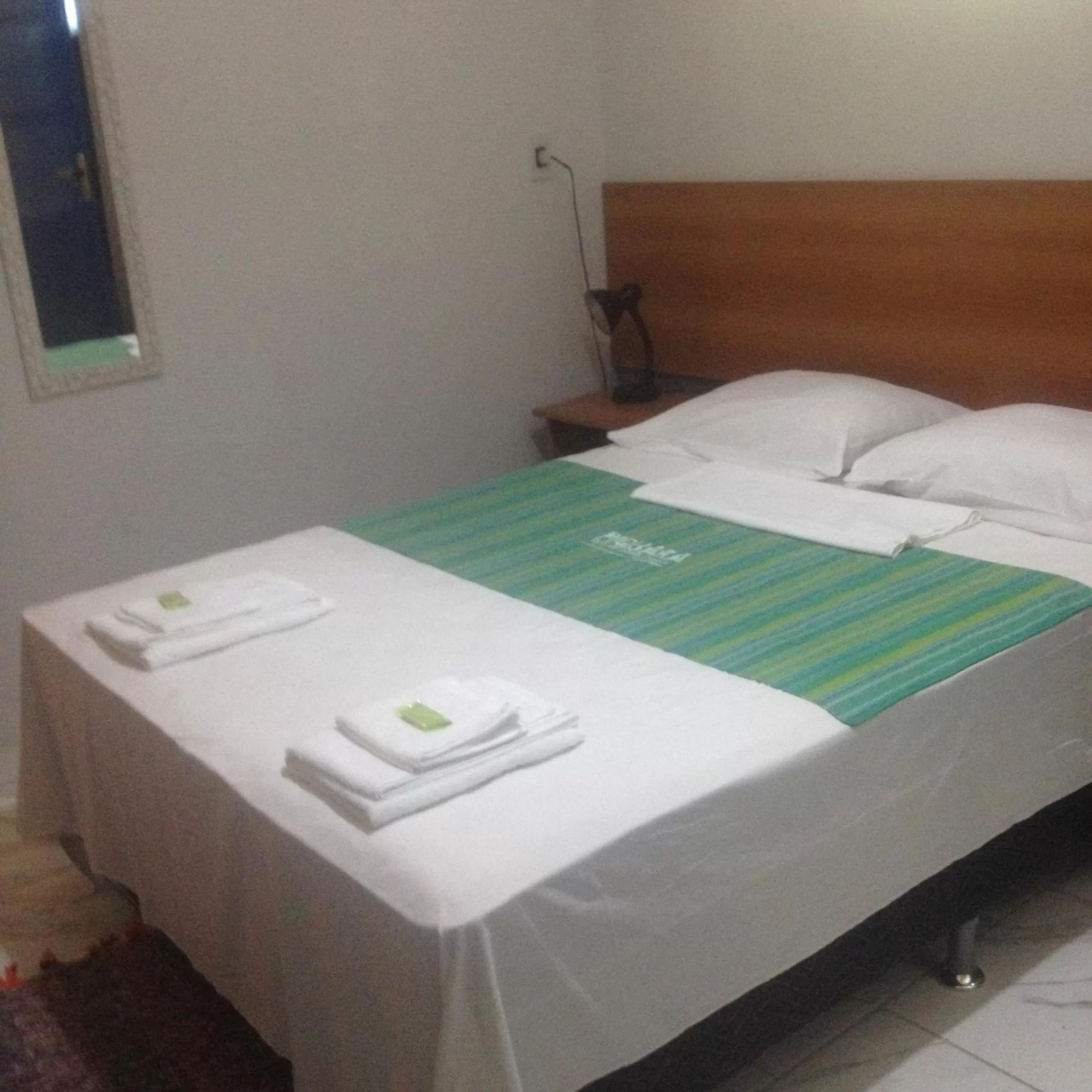 Bed in Pousada Piquara