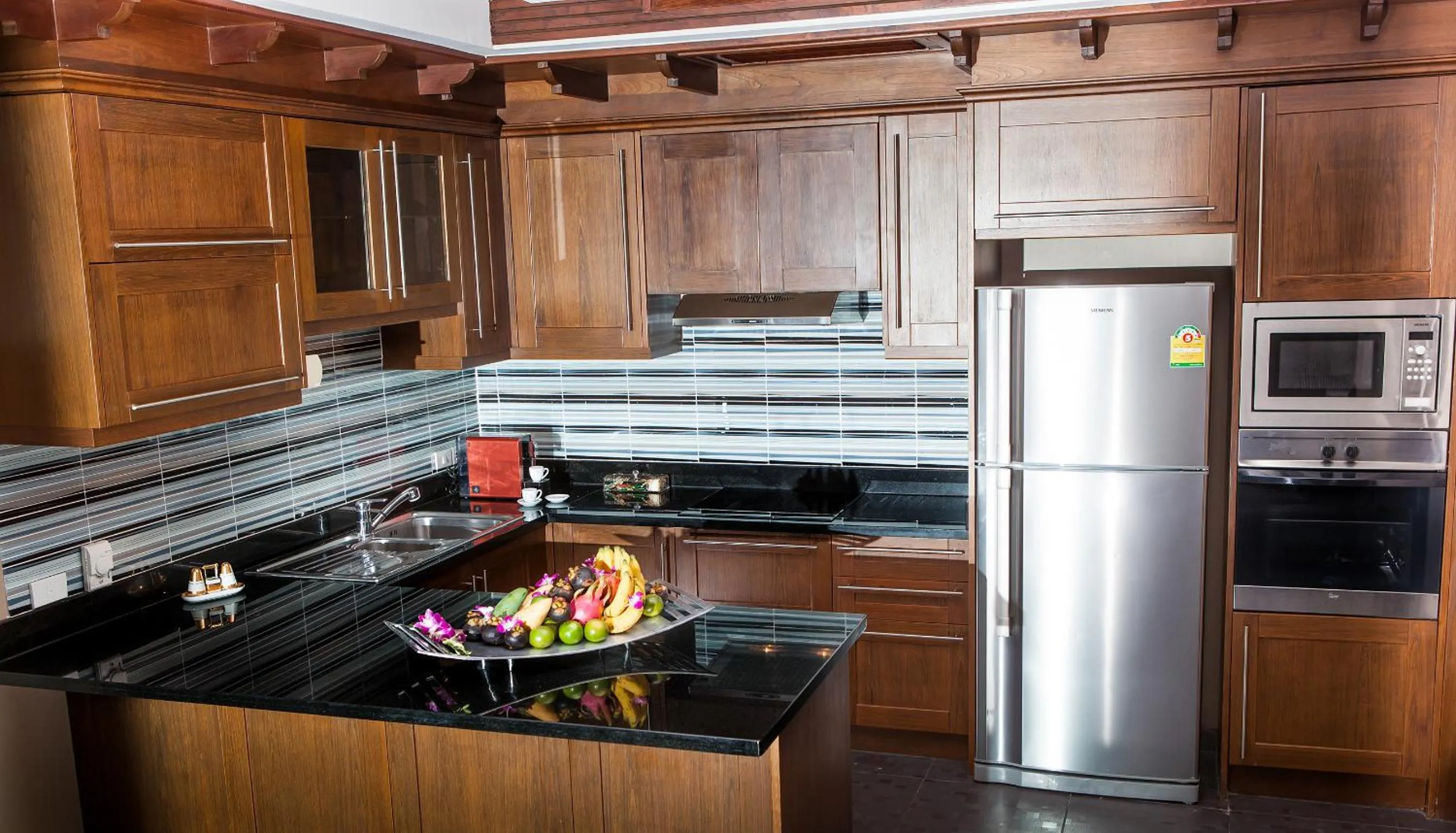 Kitchen or kitchenette in Ammatara Pura Pool Villa