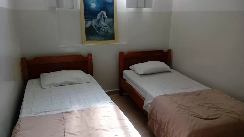 Property building, Bed in Hotel Cadore