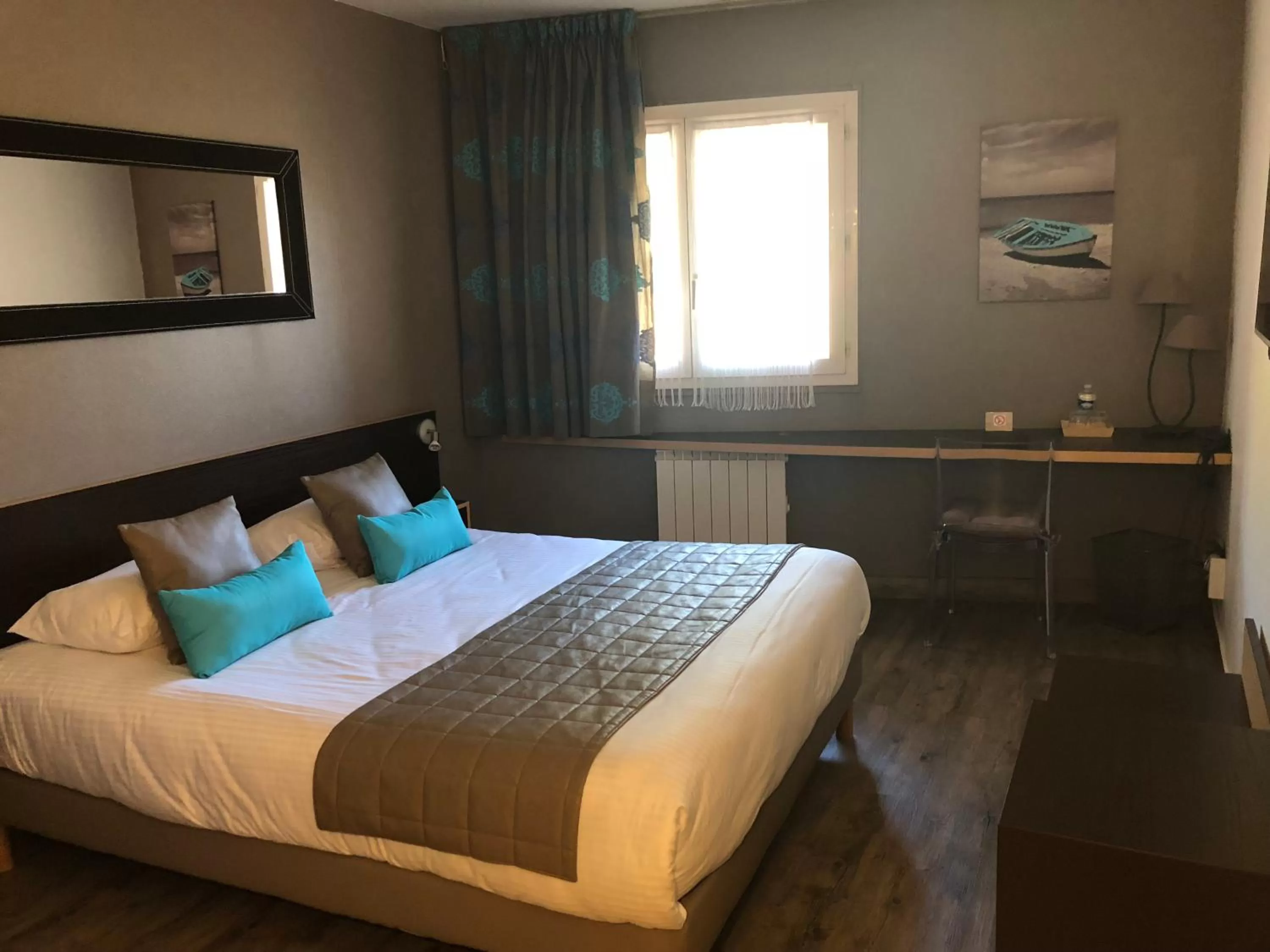 Bed in Logis Hôtel Burnichon