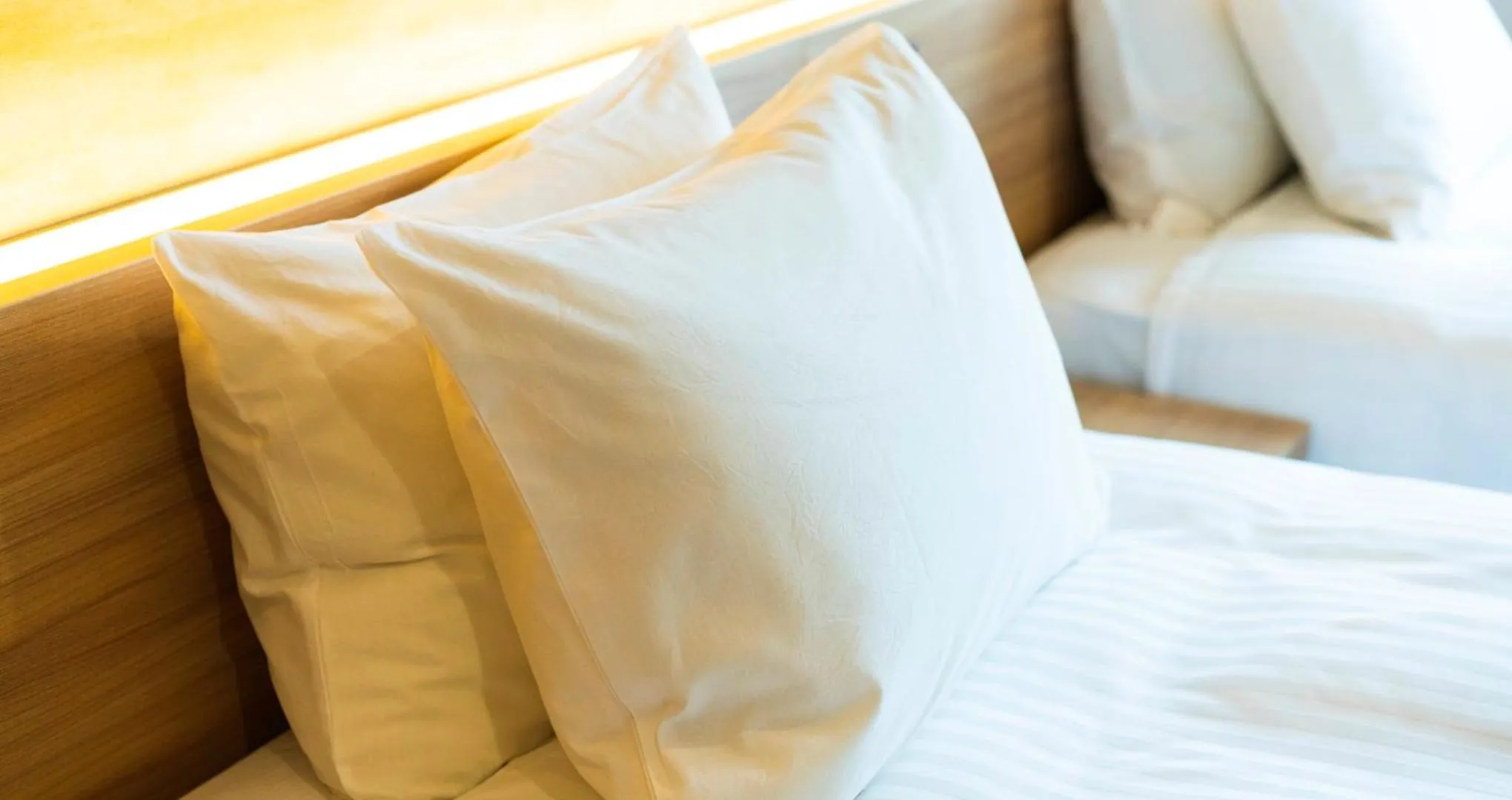 Bed in HOTEL SANSUI NAHA Ryukyu Onsen Naminoue-No-Yu