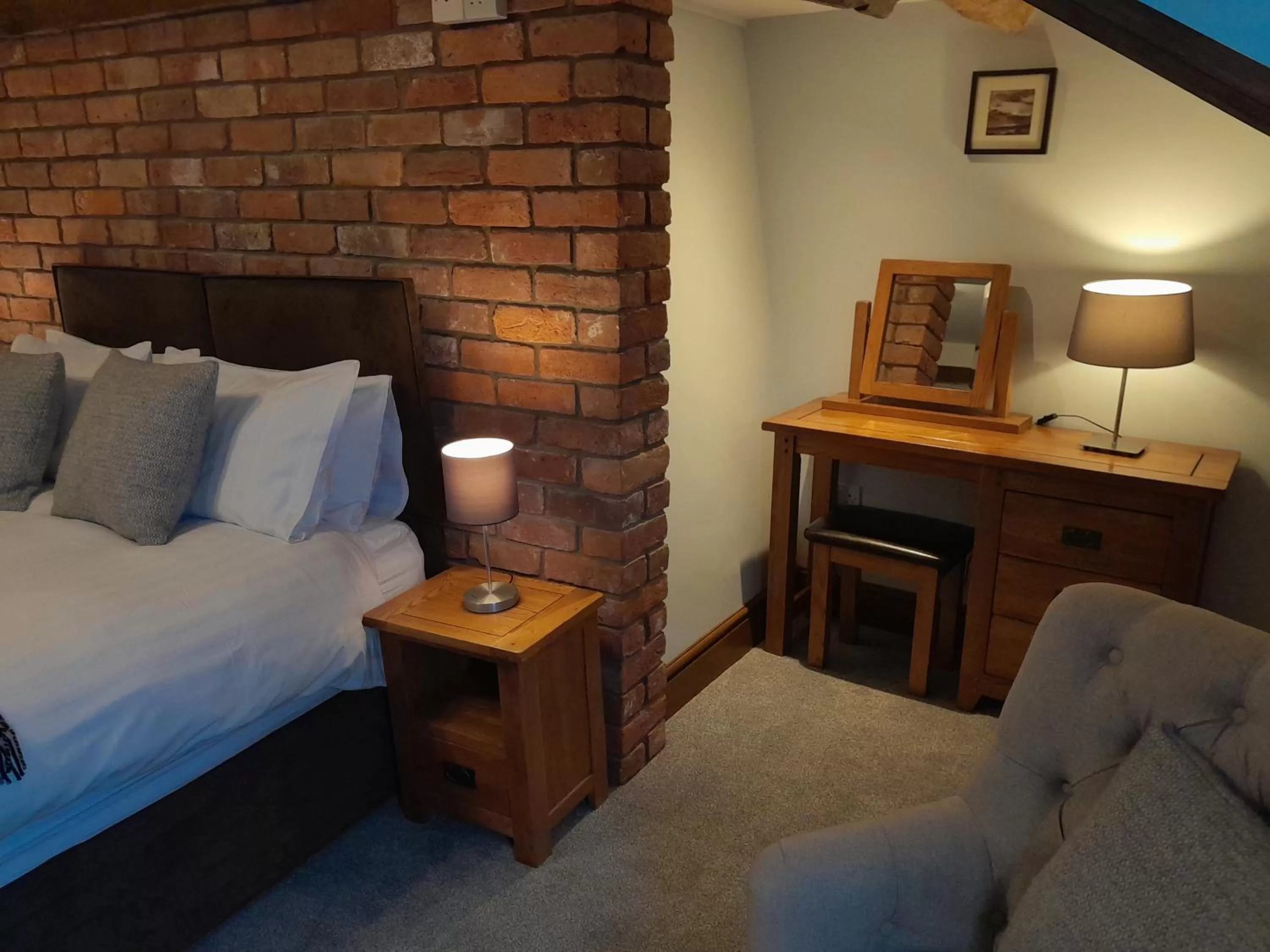 Bed in The Dolfor Inn