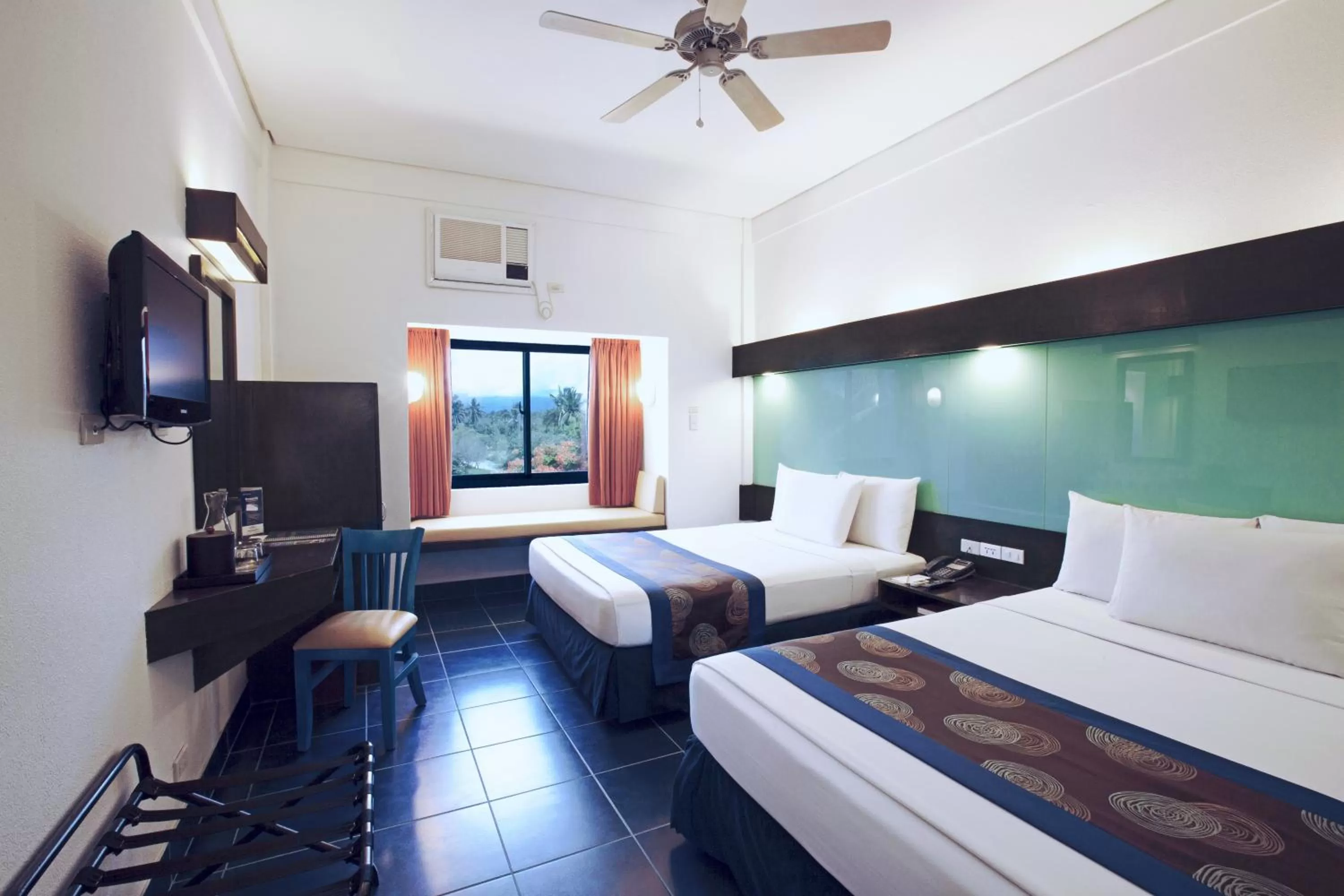 Photo of the whole room, Bed in Microtel by Wyndham Puerto Princesa