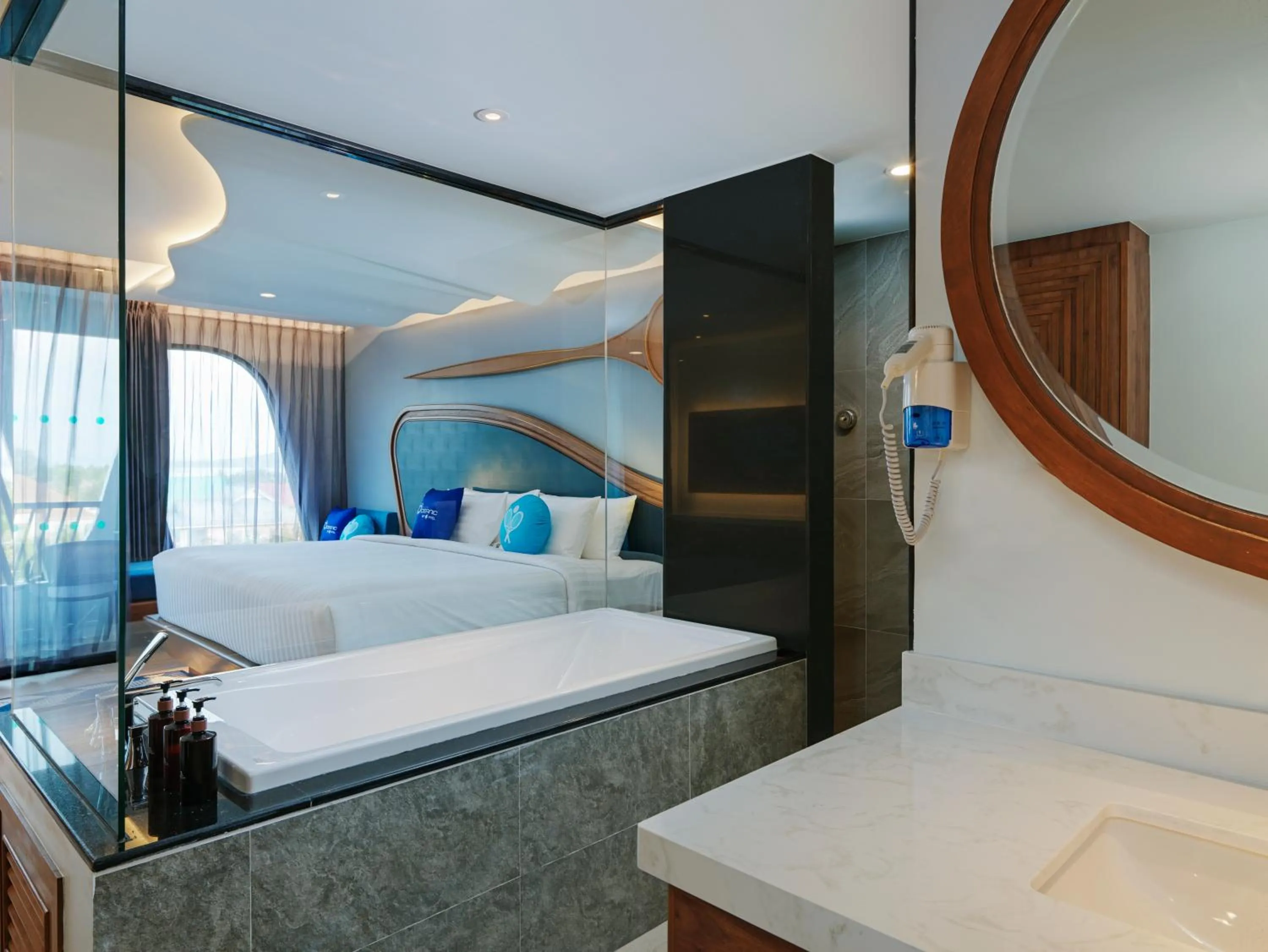 Photo of the whole room, Bed in The Oceanic Sportel Phuket - SHA Extra Plus