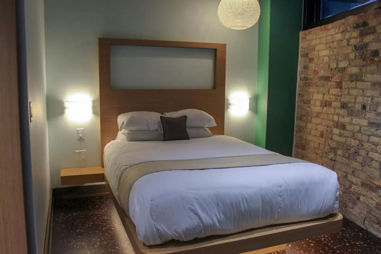 Bed in CityFlatsHotel - Grand Rapids, an Ascend Collection Hotel