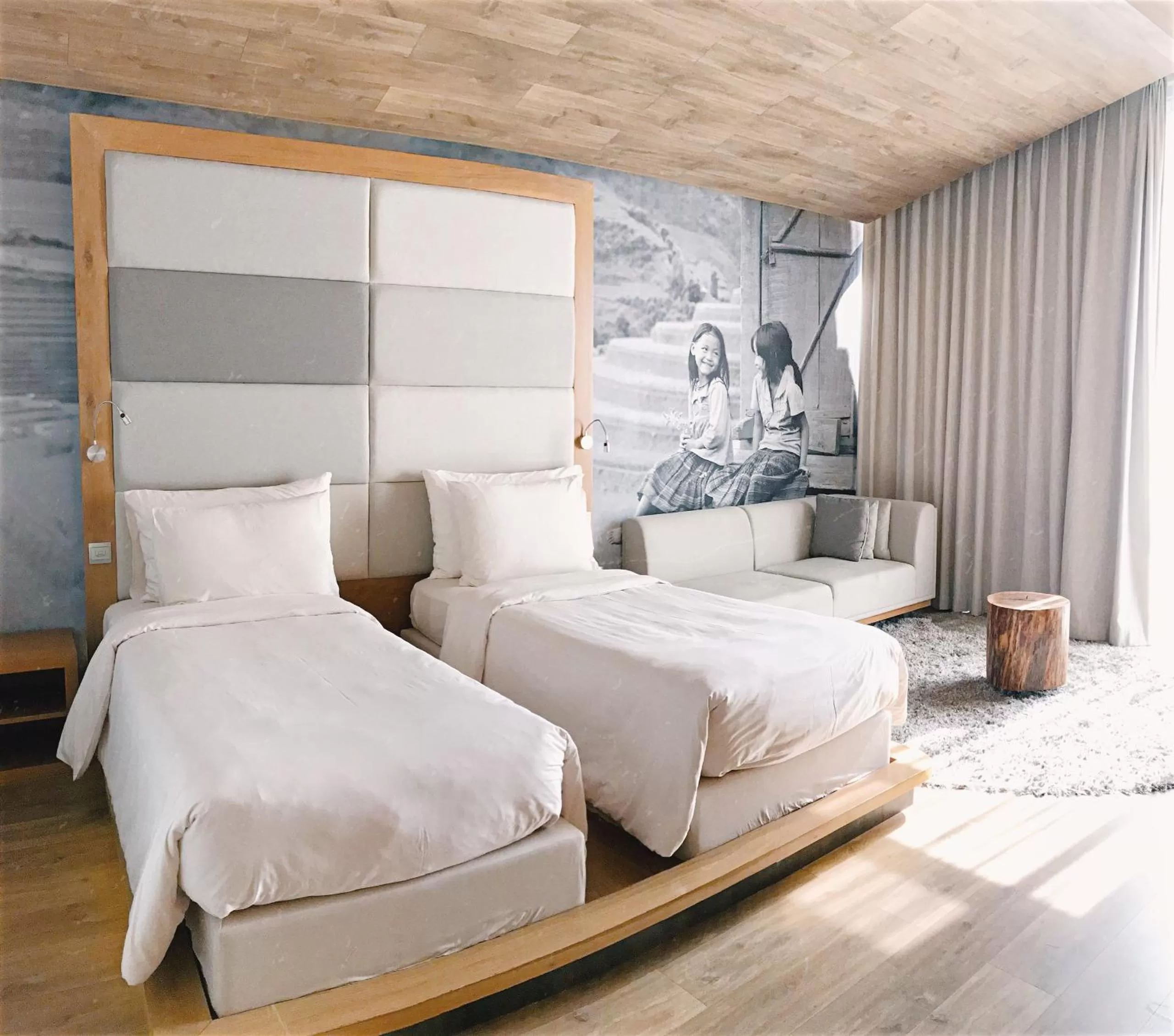 Seating area, Bed in Fusion Suites Saigon