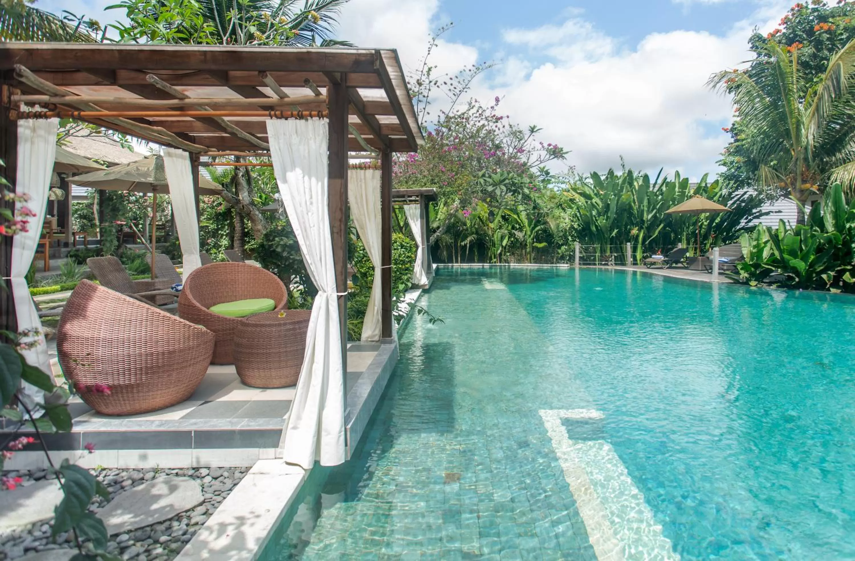 Swimming pool in Manah Shanti Suites by GenuineHost