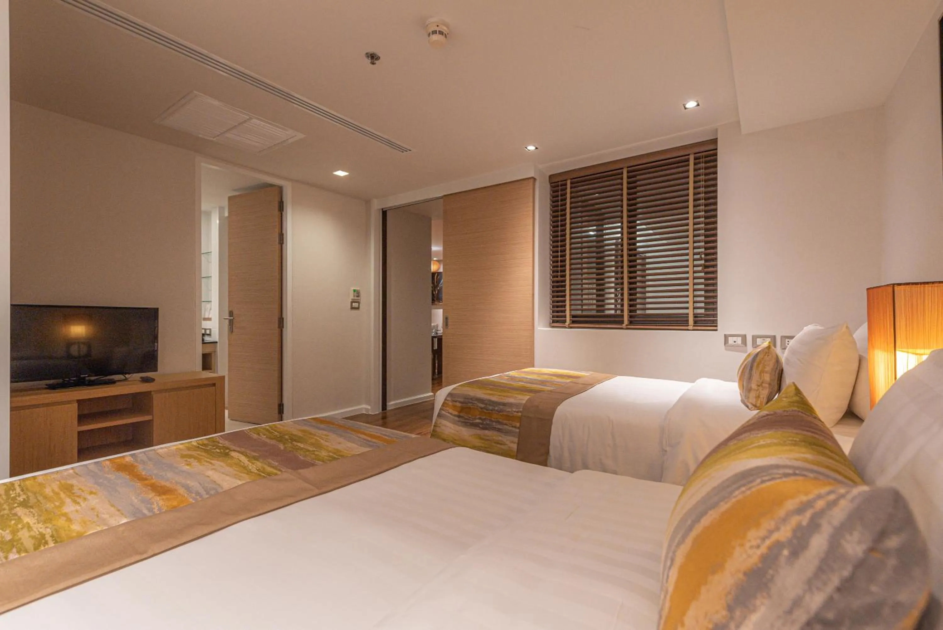 Bedroom, Bed in Summit Windmill Golf Suite Hotel at Suvarnabhumi