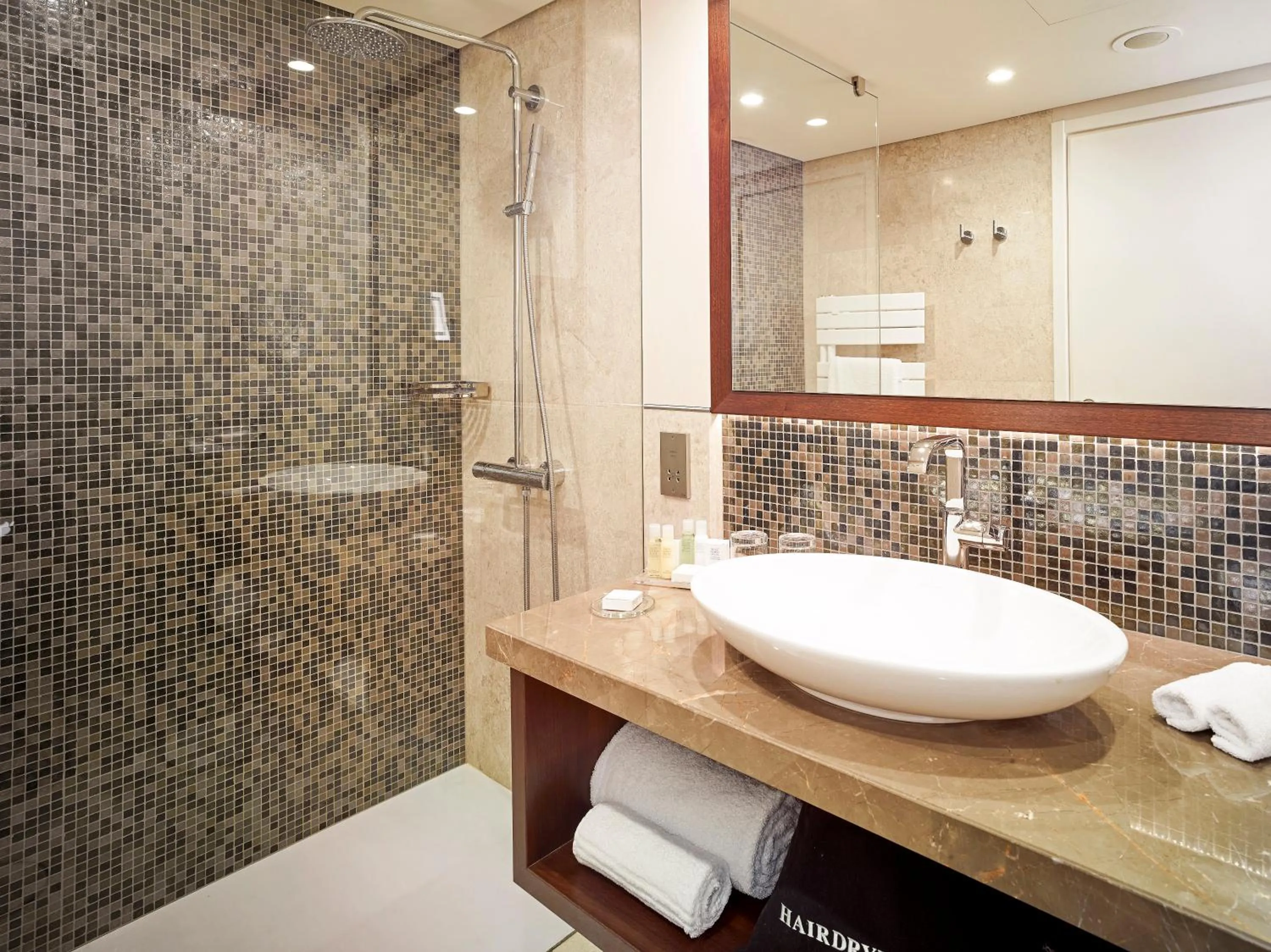 Shower in Crowne Plaza Bucharest by IHG