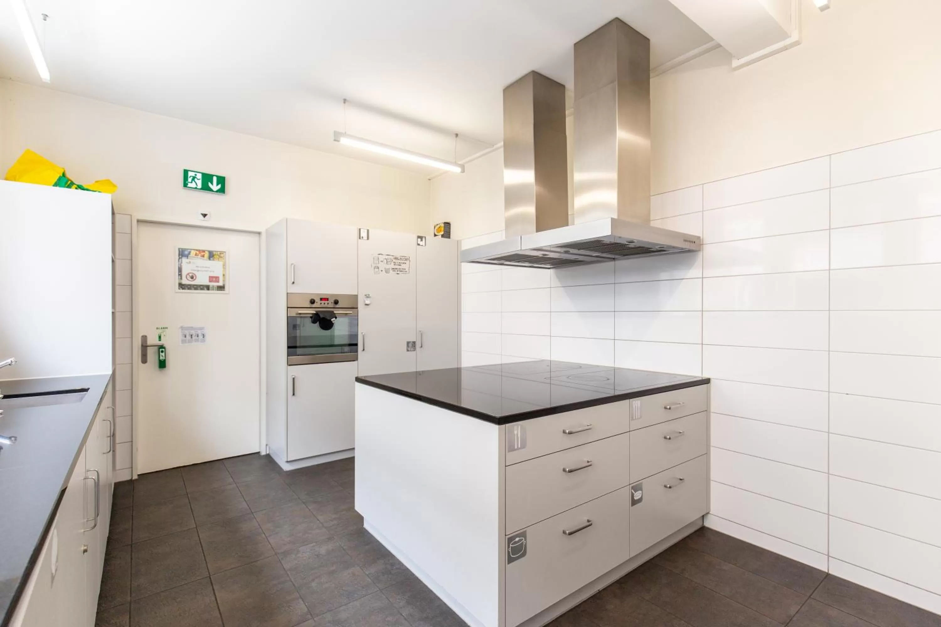 Communal kitchen in Hotel by Hyve Basel