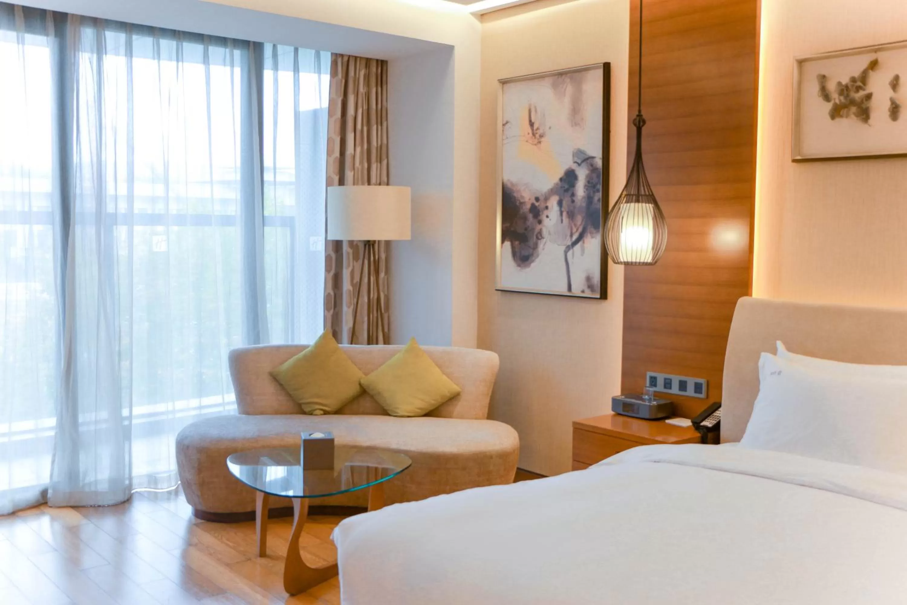Living room, Bed in Holiday Inn Nanjing Xuanwu Lake by IHG