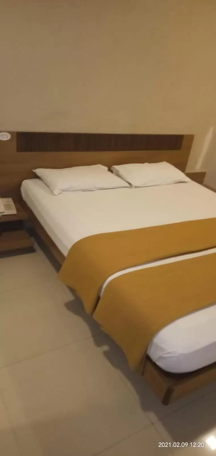 Bed in Sai Palace Budget Hotel