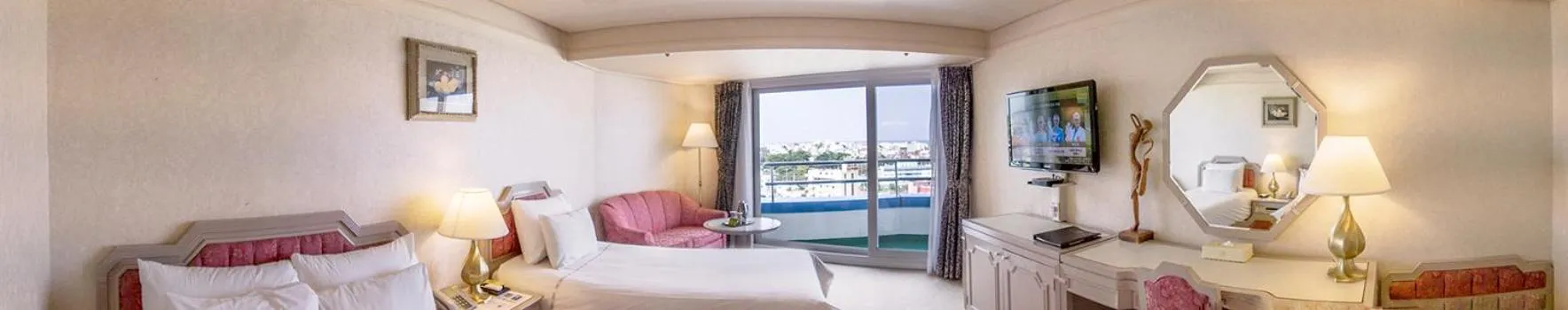 Bed in Jeju Pacific Hotel