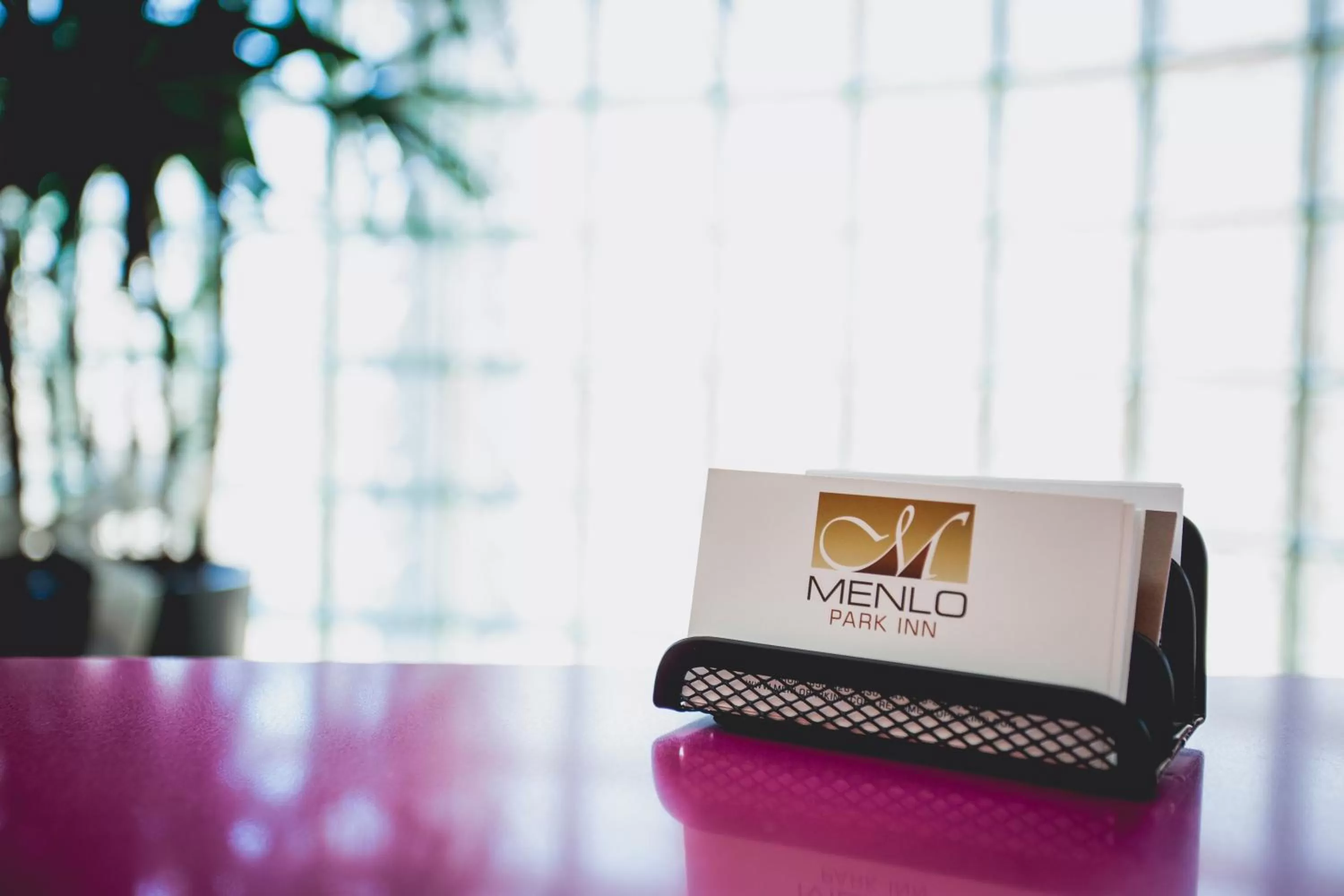 Property logo or sign in Menlo Park Inn