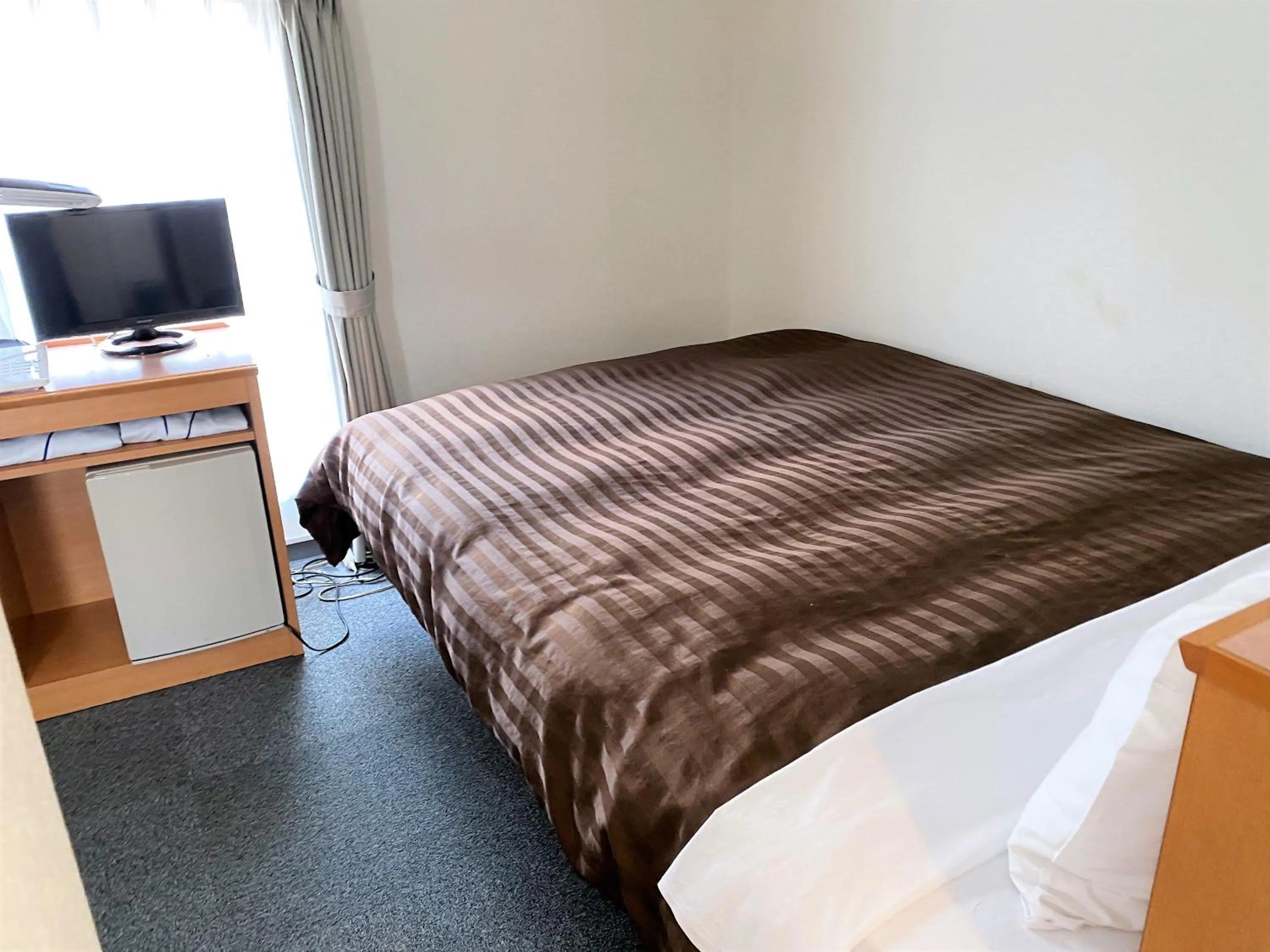 Bed in Sakura Hotel Hatagaya