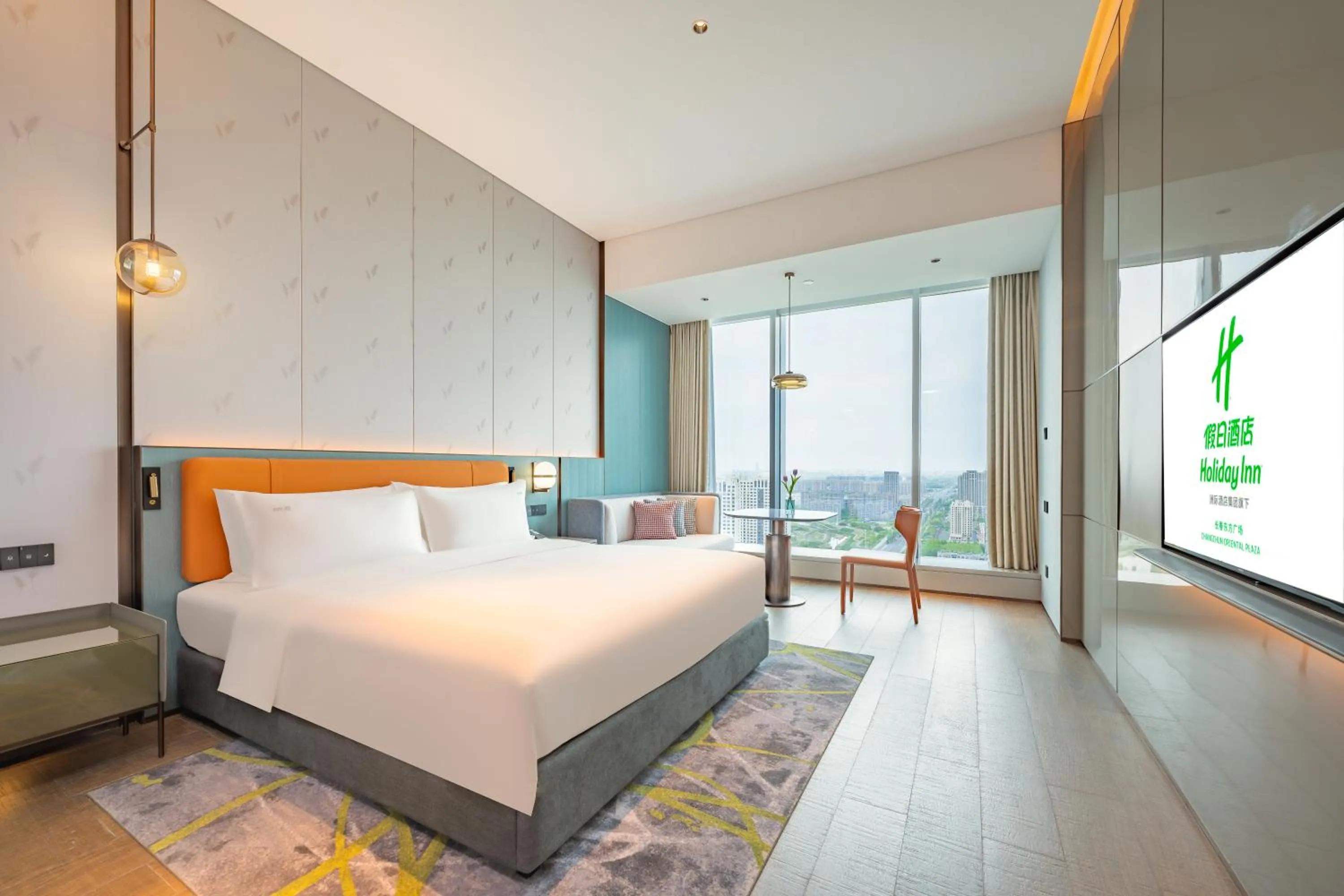 Communal lounge/ TV room, Bed in Holiday Inn Changchun Oriental Plaza by IHG