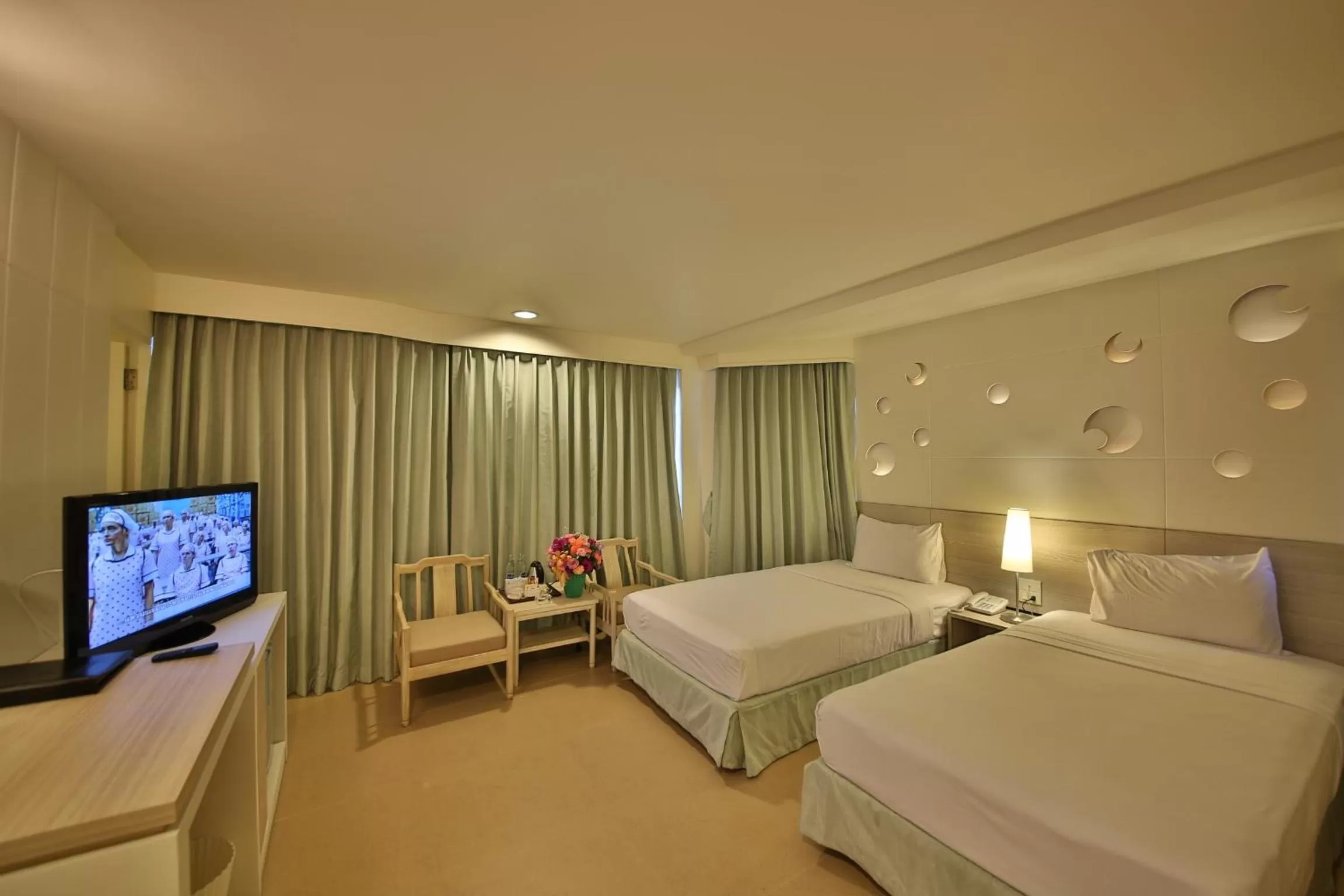 Bed in Sunshine Hotel & Residences