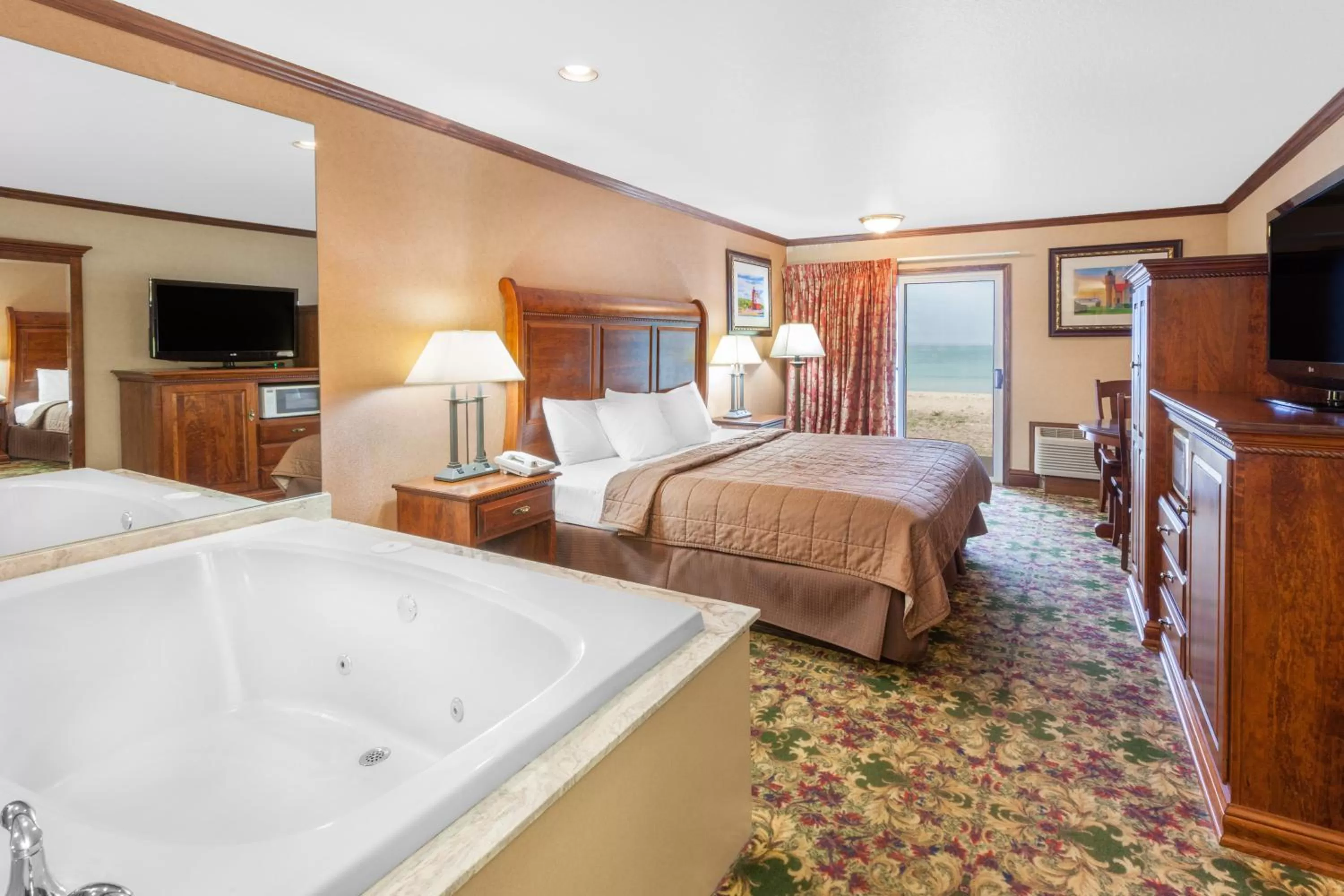 Photo of the whole room, Bed in Ramada by Wyndham Mackinaw City Waterfront