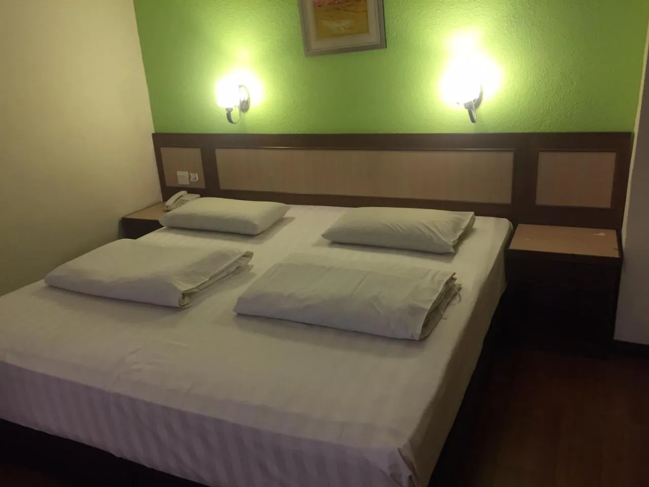 Bed in The Inn Hotel